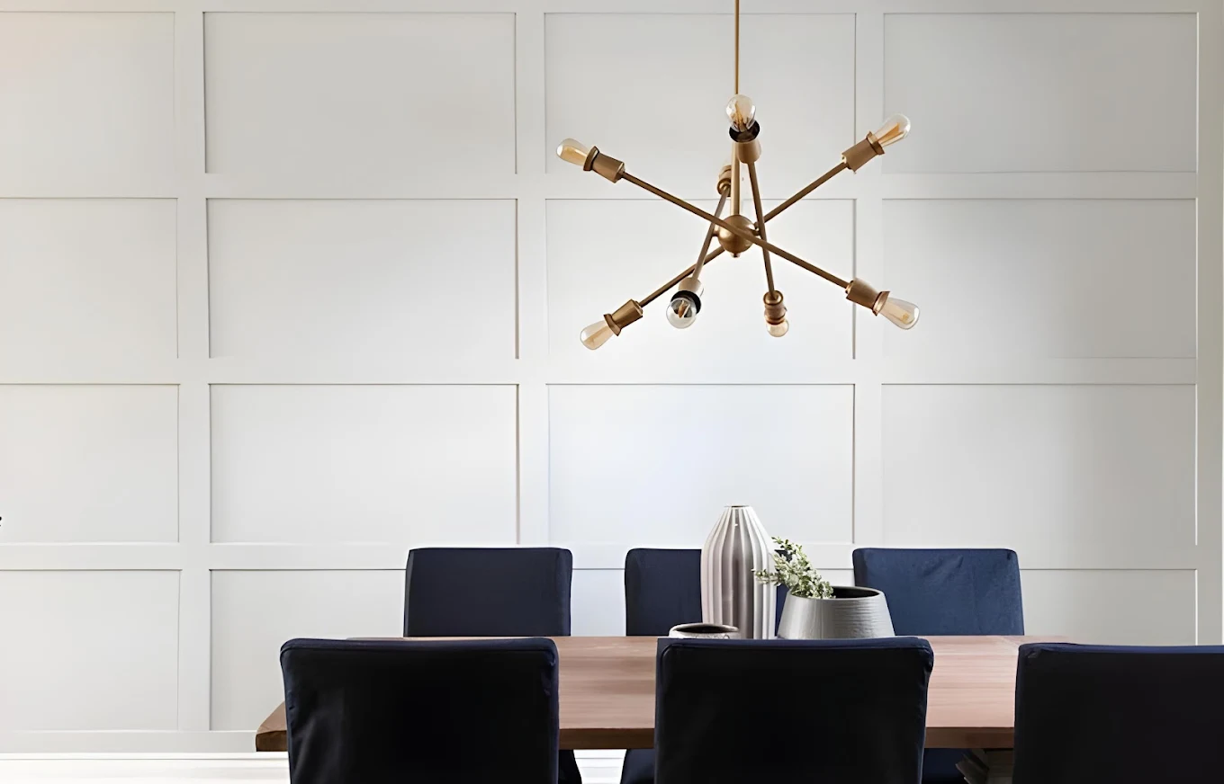 Modern kitchen with island and stainless steel appliances.