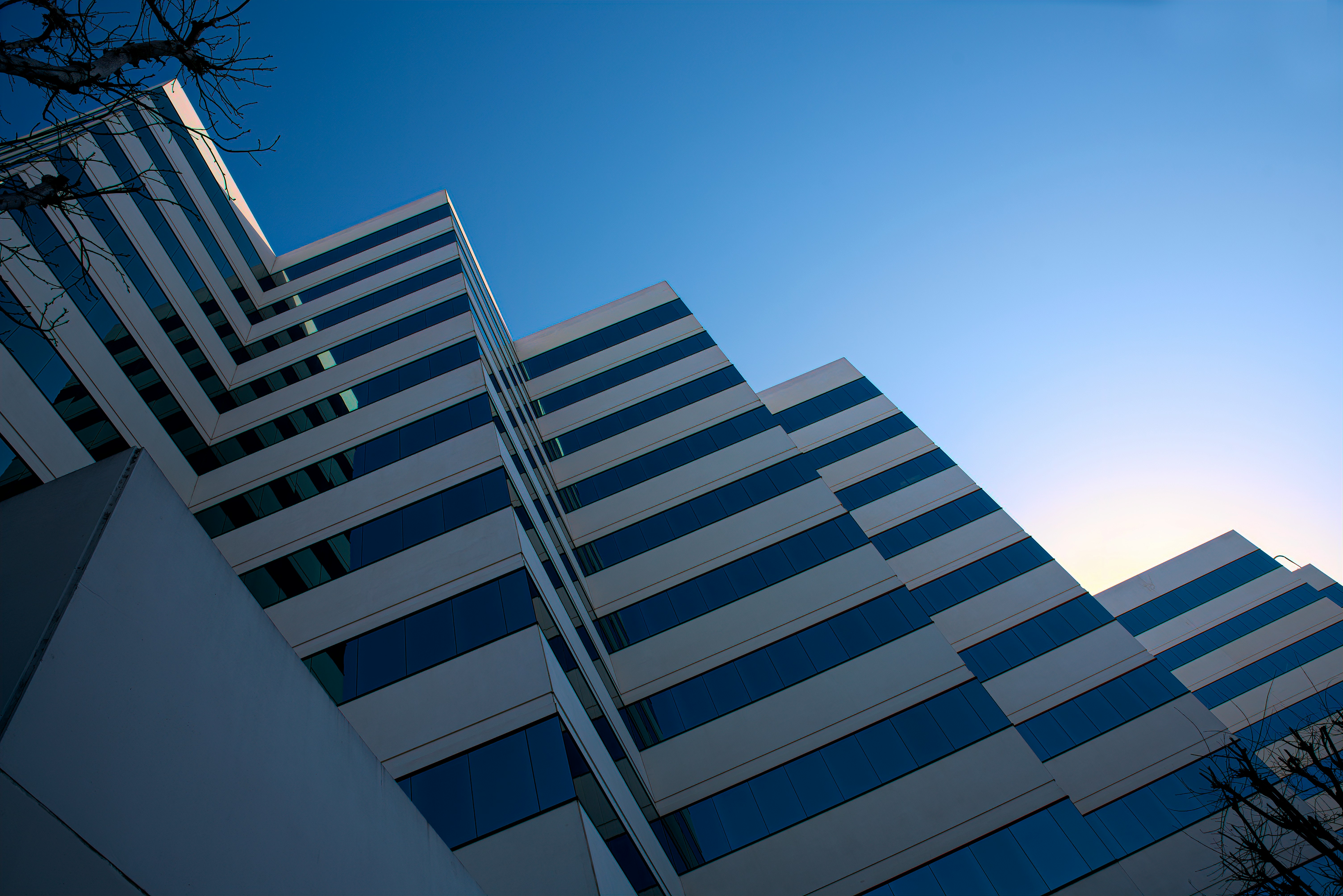 white and black concrete building under blue sky during daytime