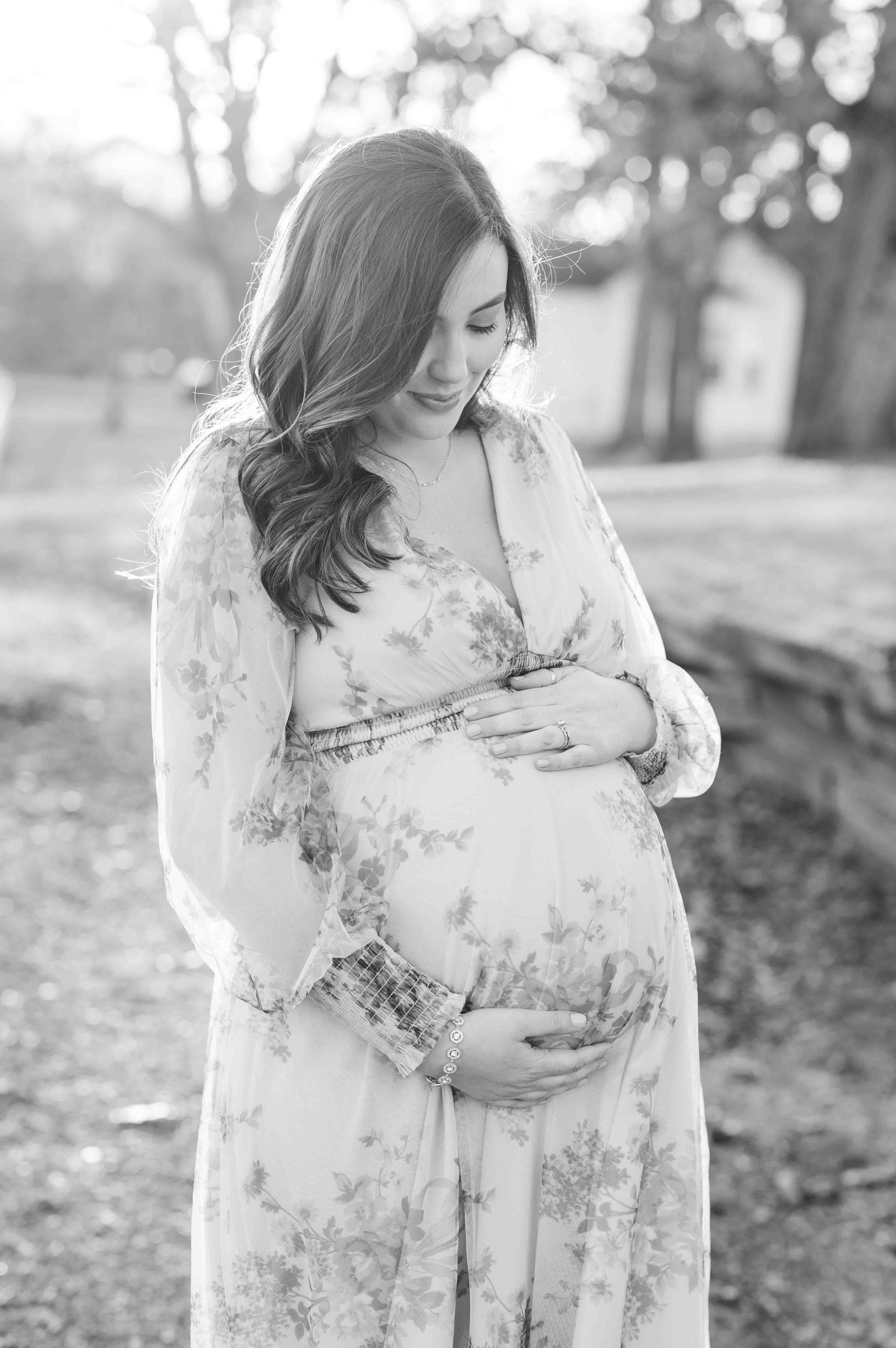 Black and white maternity portrait of mother and baby.