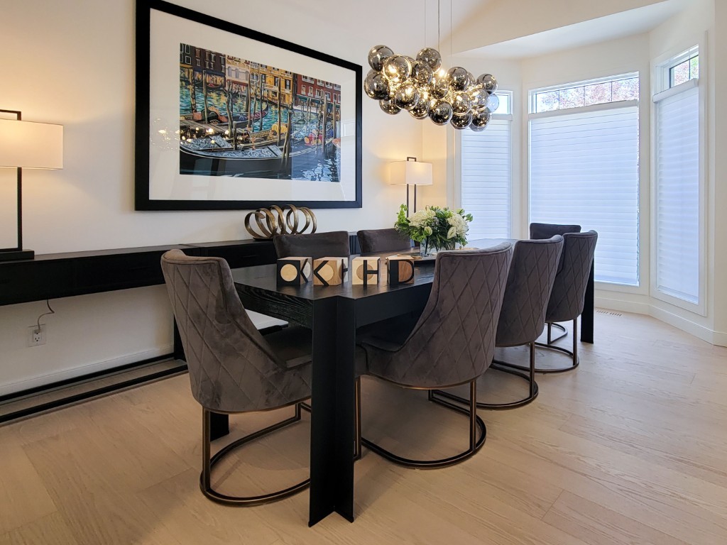 Image of KHD Homes interior design featuring a modern dining room with furniture and luxurious window coverings.
