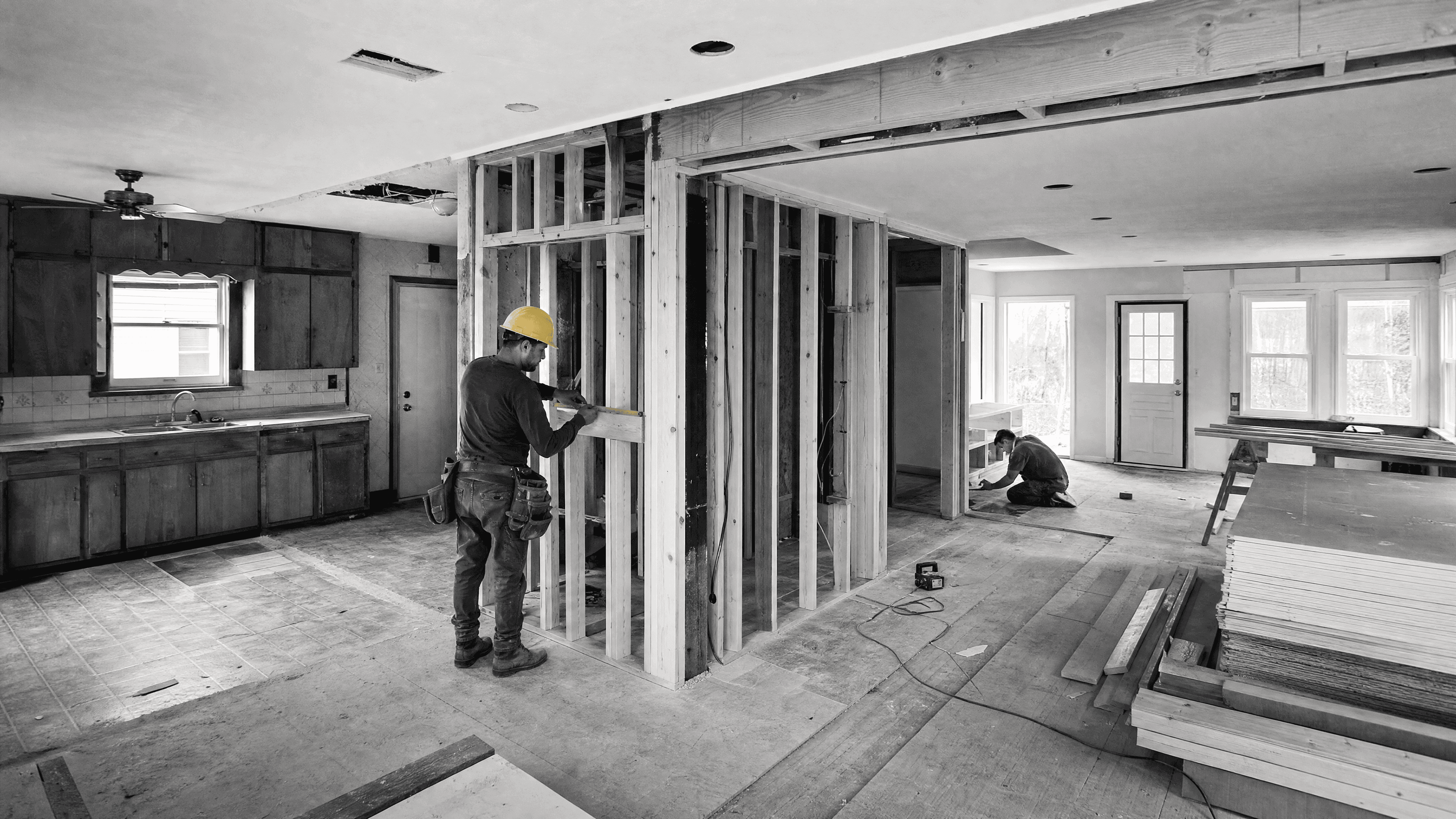 Residential fix-and-flip renovation with dated finishes, new framing, and active rebuilding underway.