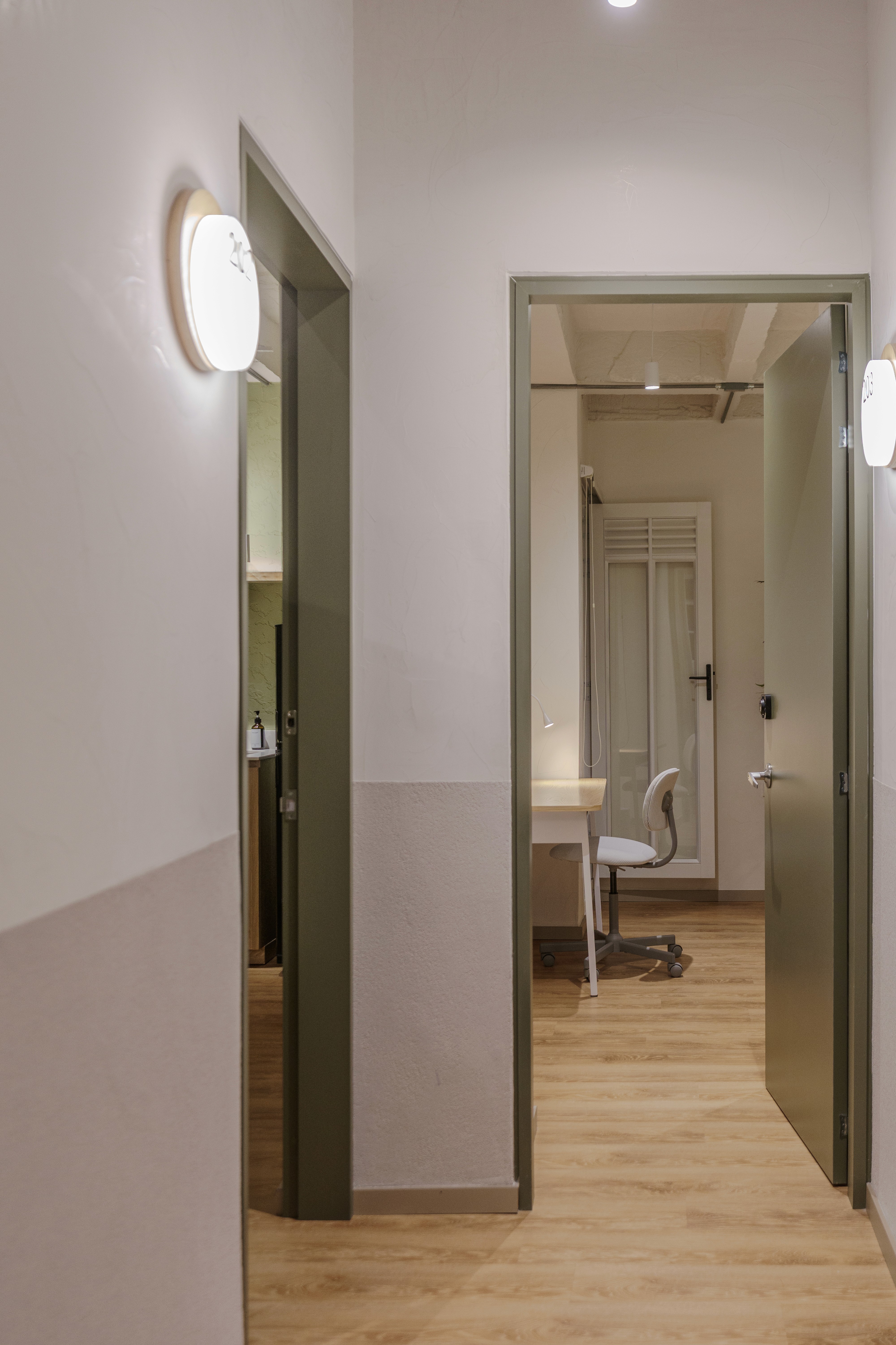 Double-height interior with flowing sculptural forms and warm raking light