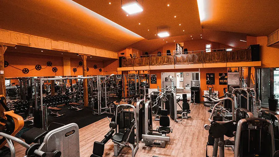 Unique concrete and earth-covered building entrance in a dry, sunny landscape.