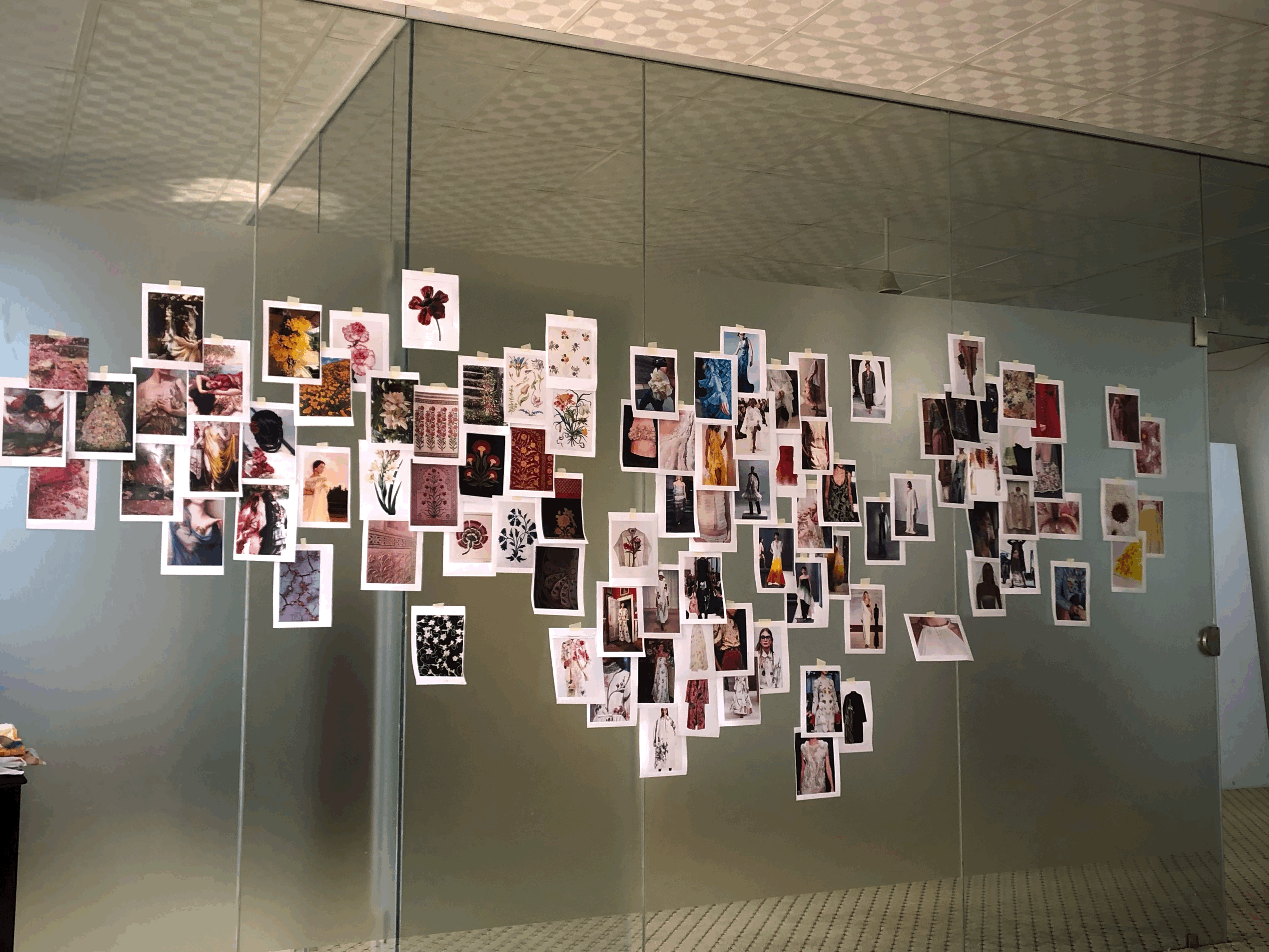 a blurry photo of a person standing in front of a wall