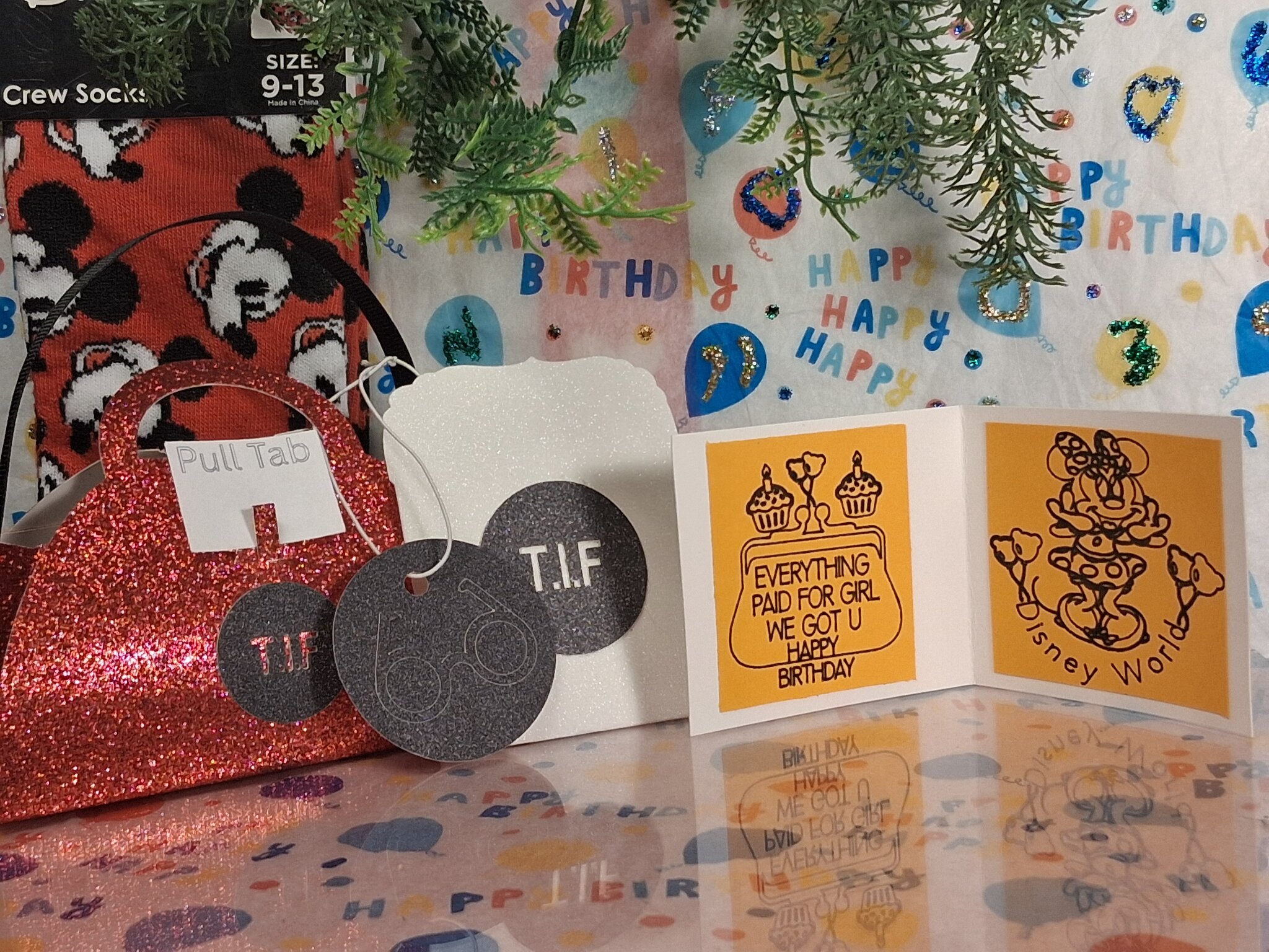 Disney-themed birthday gift set featuring handmade greeting card, glitter purse, tags, and complimentary Mickey socks.
