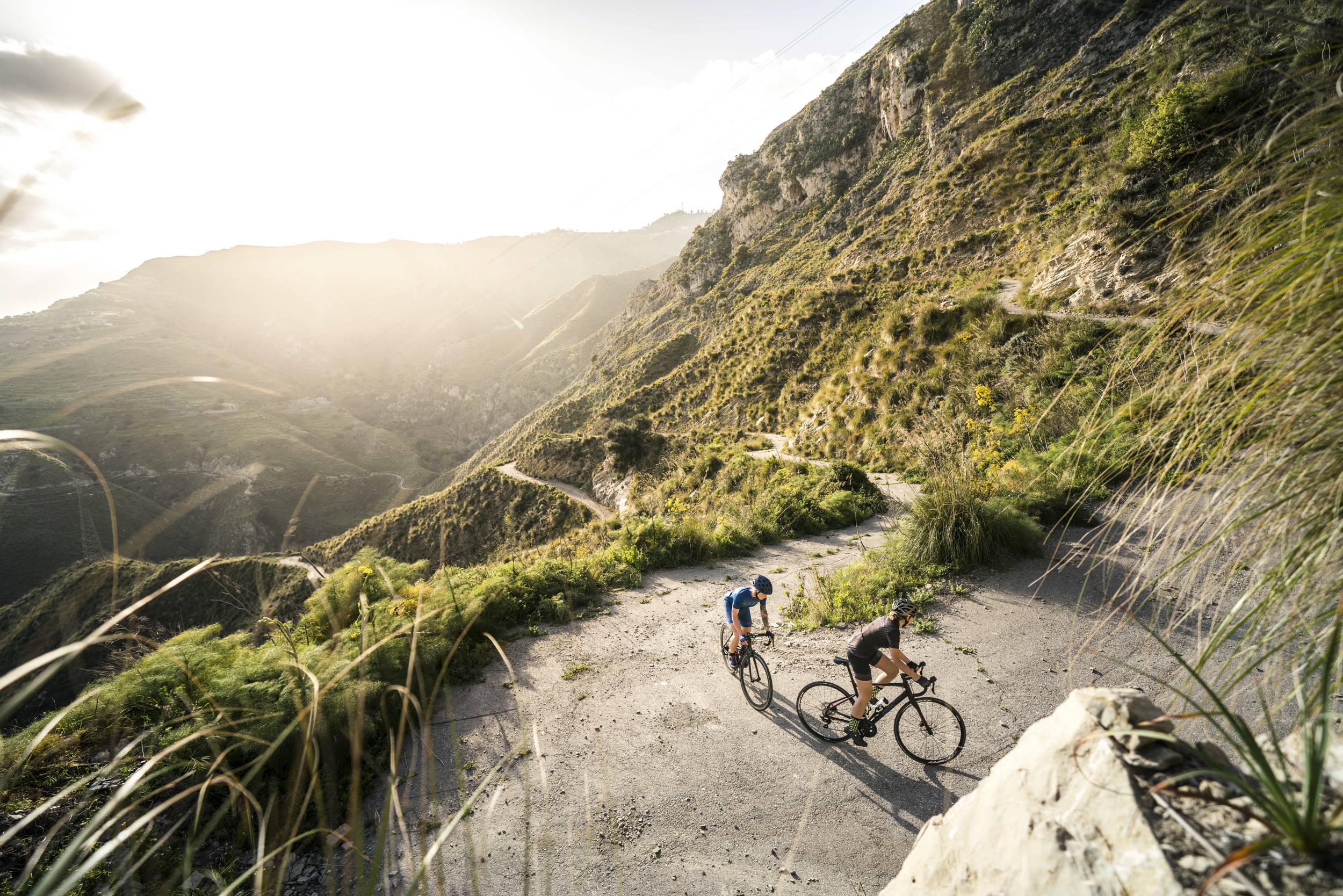 Two road cyclists on a climb on Sicily