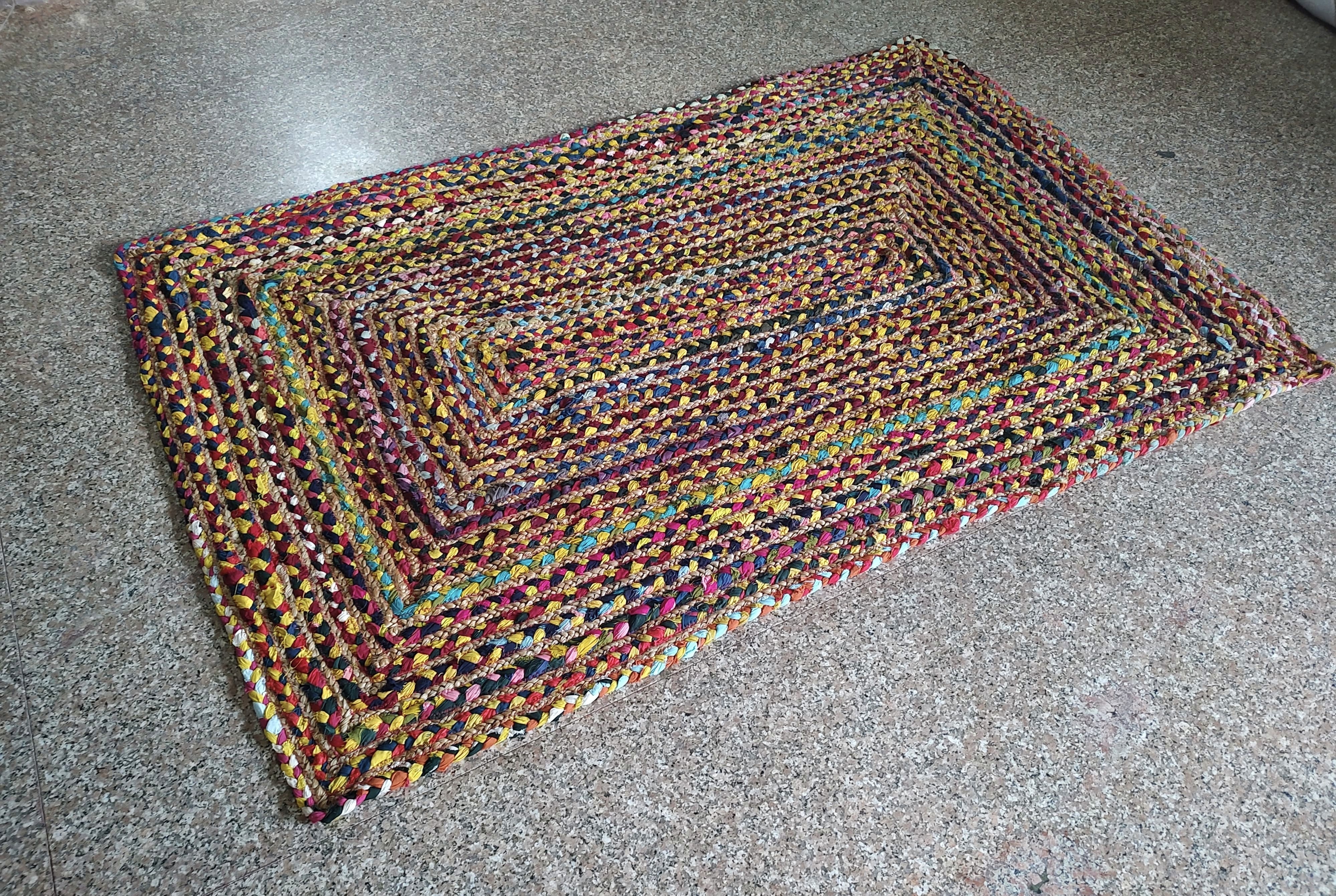 Handwoven rectangular multicolor braided floor rug