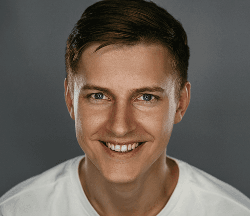 man in white crew neck shirt smiling