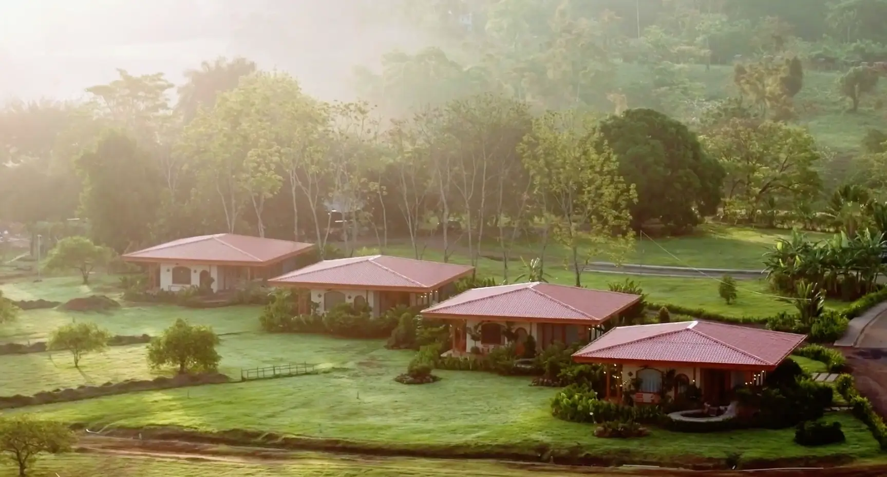 Arenal Hills at sunrise with villas