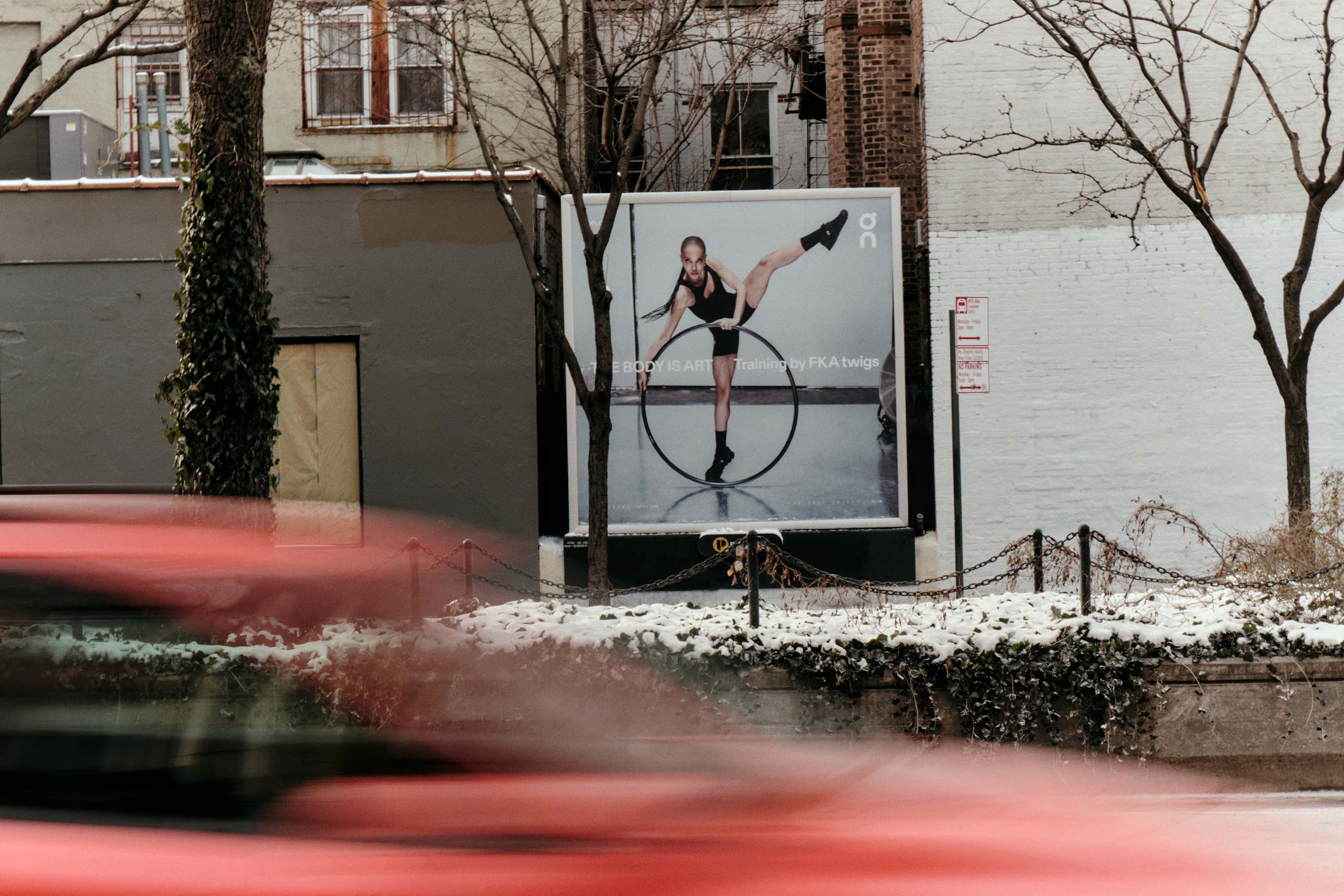 Streetside billboard with flyposters of the Batch.Works brand and illustrations