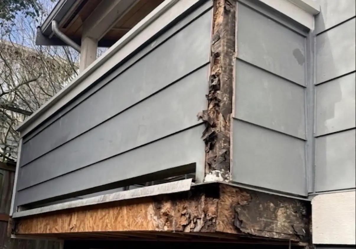 Dry rot damage exposed around exterior sheathing and trim