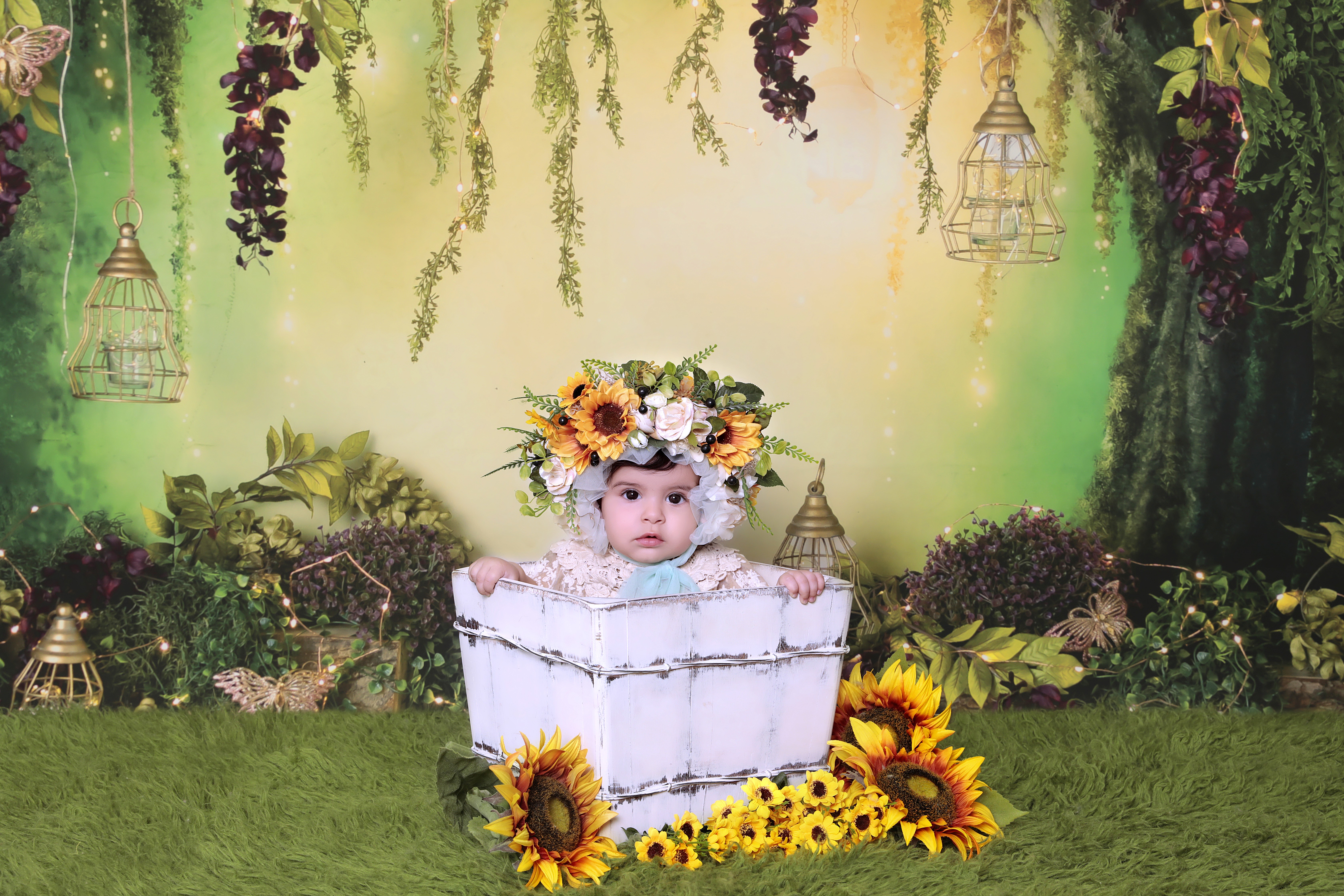 Baby in newborn photoshoot age with a flower themed decor. 