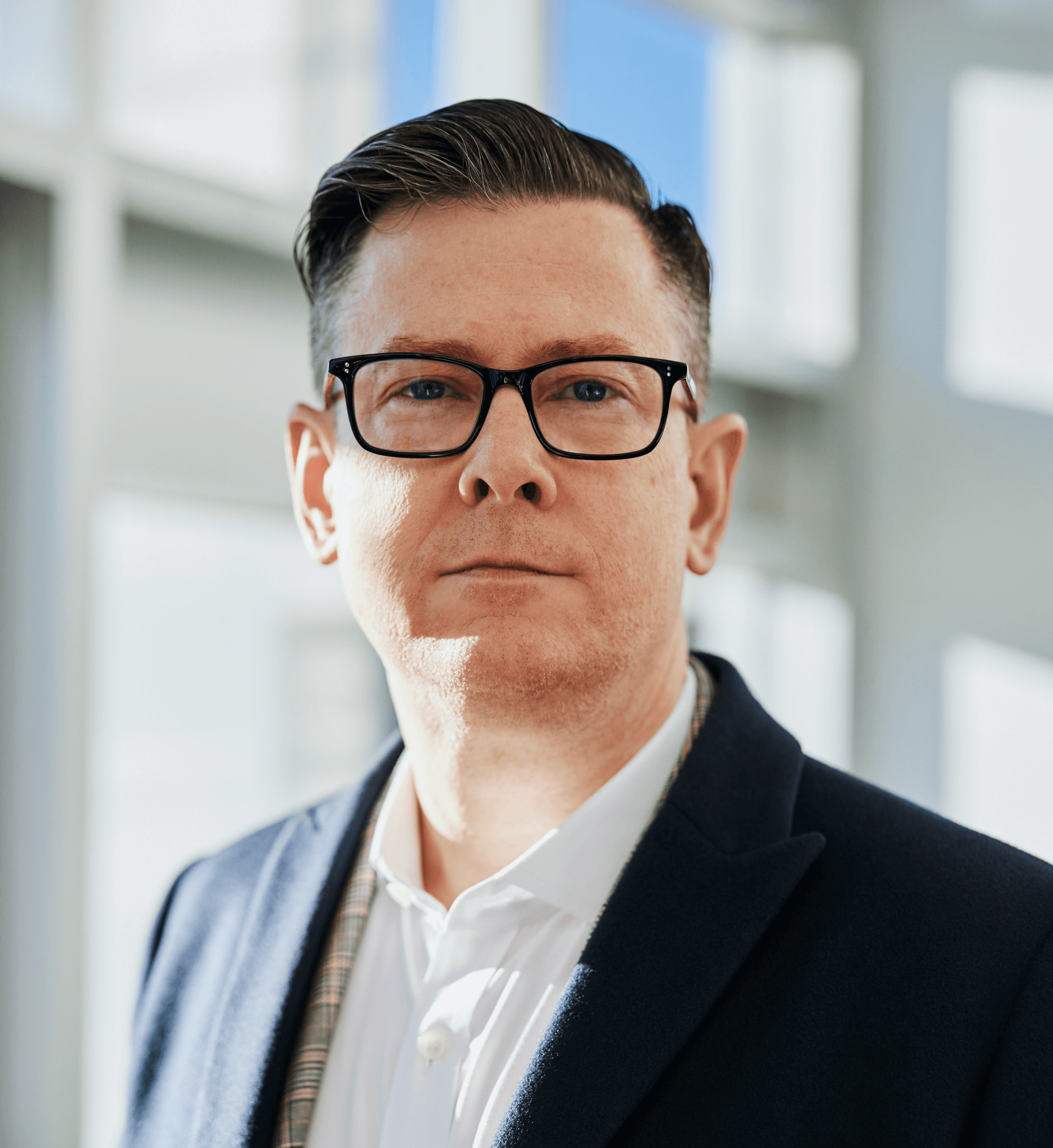 man standing beside wall