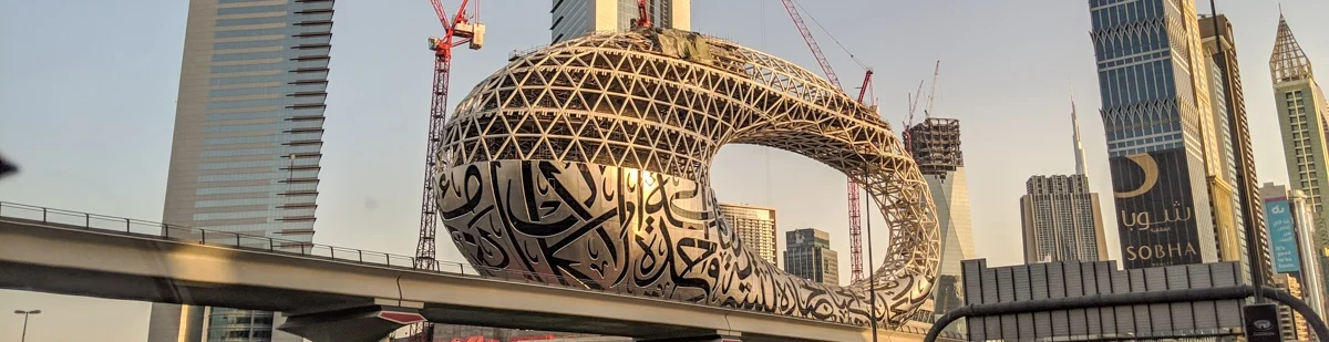 An image showcasing a modern, curved architectural structure under construction.