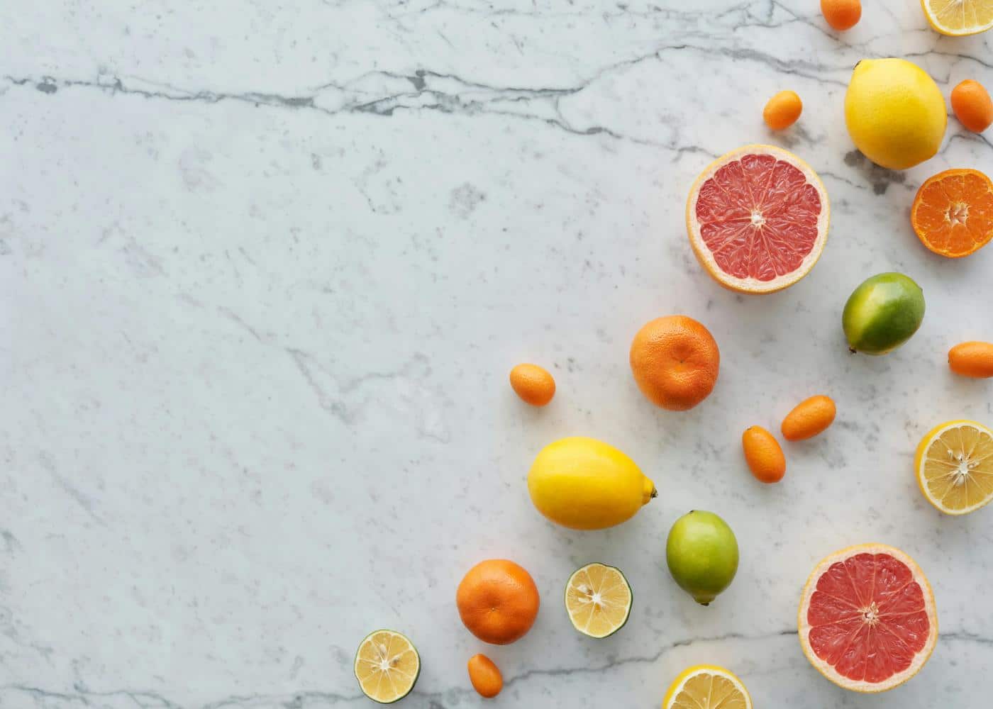 Citrus fruits on marble surface to showcase a functional nutrition diet
