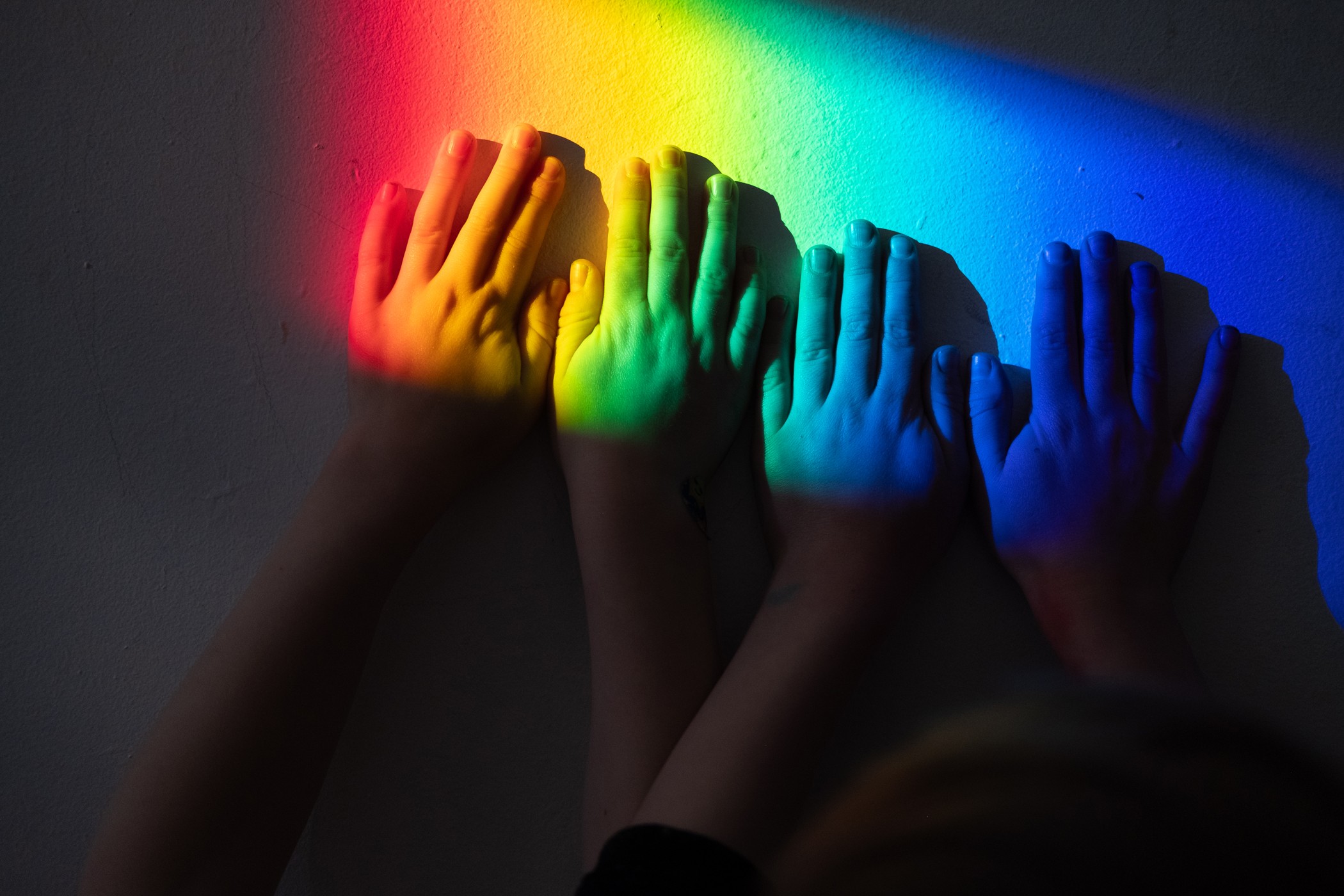 artistic-hands-with-rainbow-prism-light-katt-jones-photography
