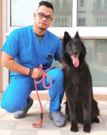 Victor with a newly groomed dog at Star Veterinary Clinic