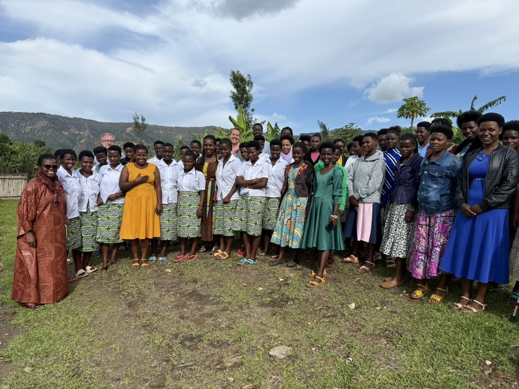 Portrait of women standing together outdoors during a community or organizational event