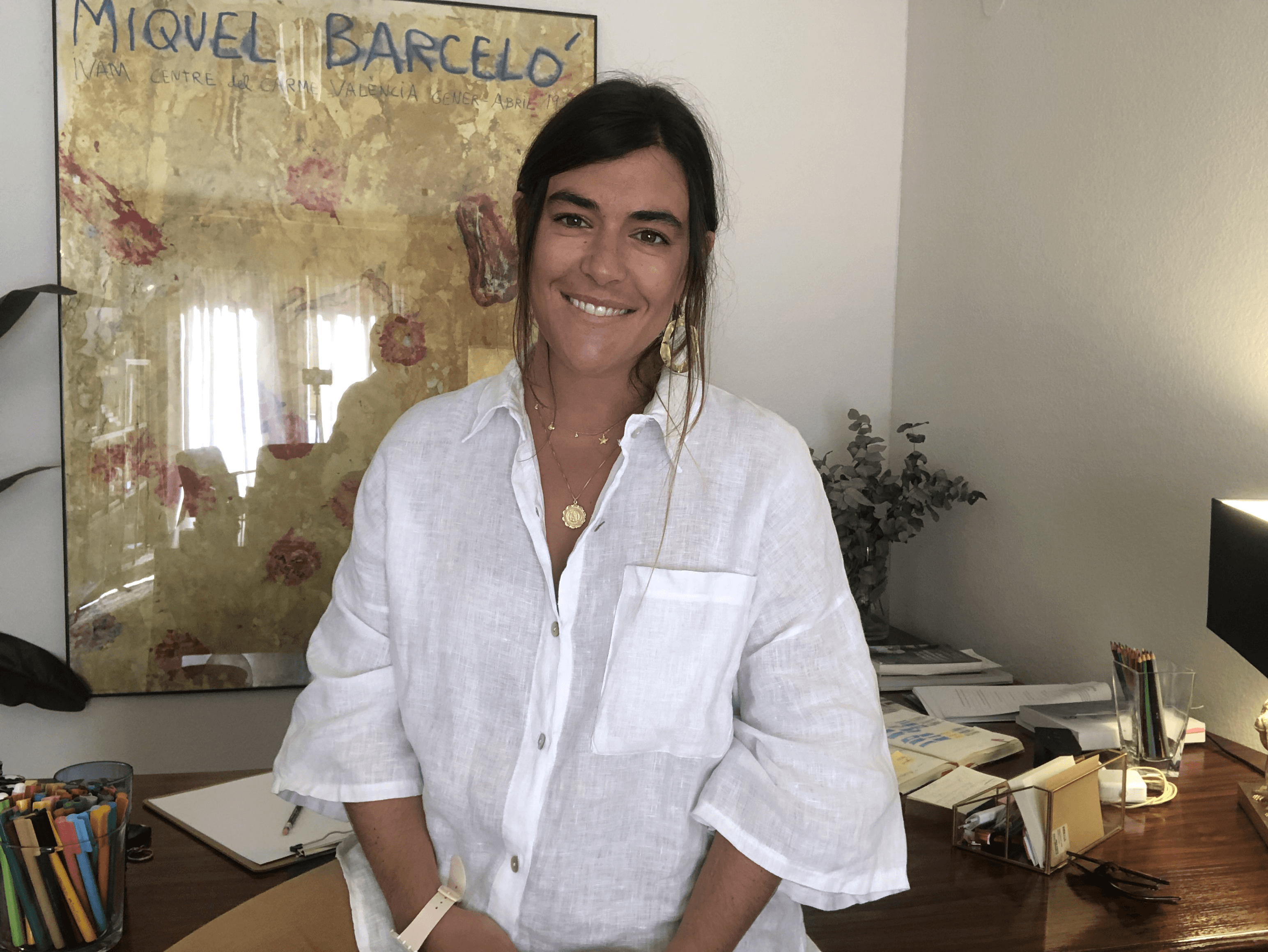 a man sitting at a desk in front of a computer