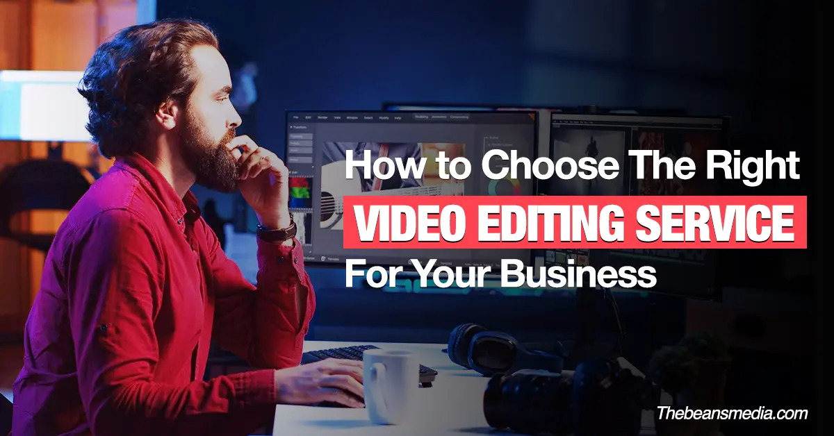 A man in a red shirt sits at a desk working on a computer with dual monitors, editing videos. Overlaid text reads: “How to Choose The Right Video Editing Service For Your Business.” The image represents choosing professional video editing services. Source: Thebeansmedia.com