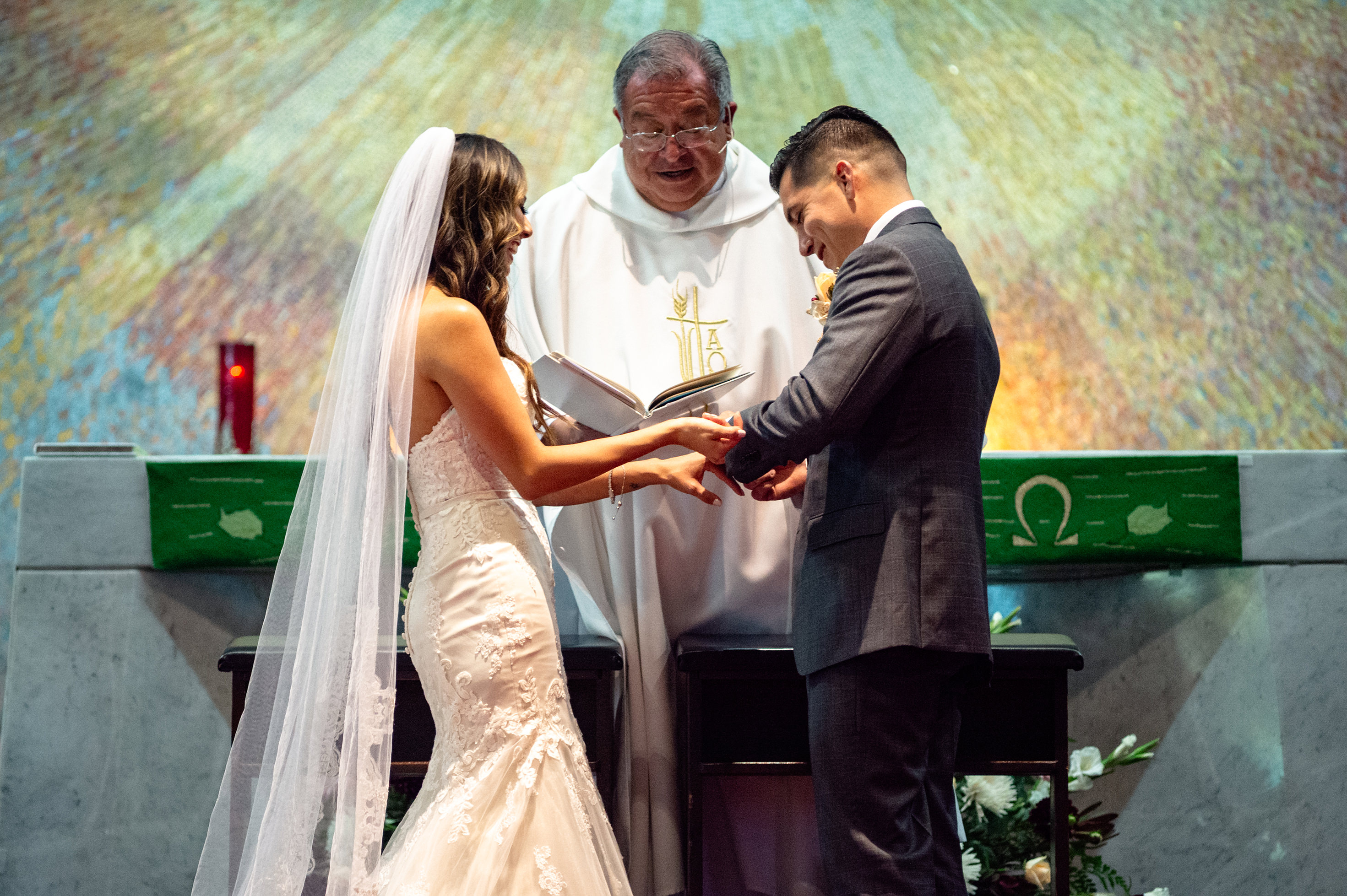 Bride and groom laughing during church ceremony