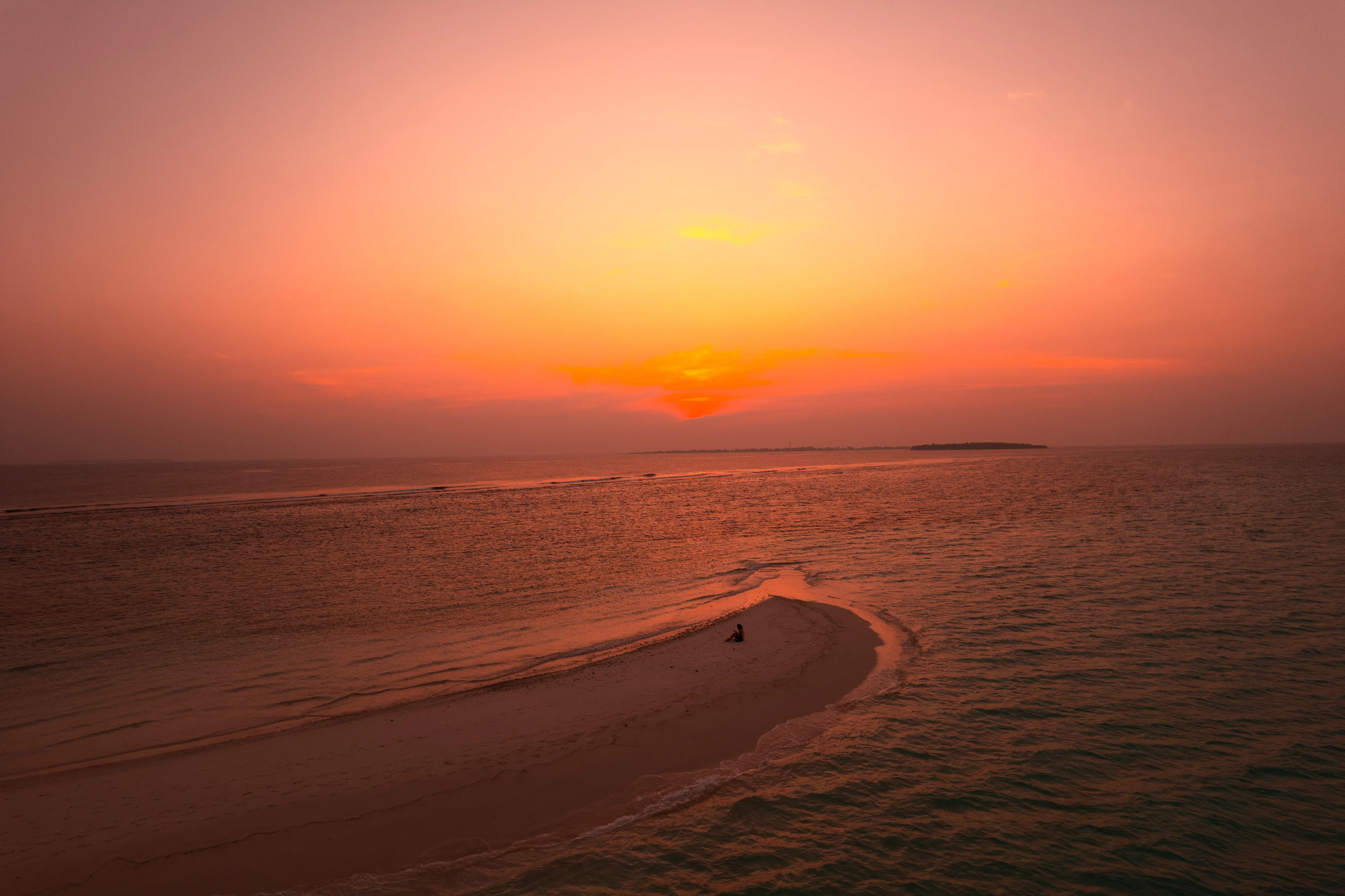 aerial view of village on mountain cliff during orange sunset
