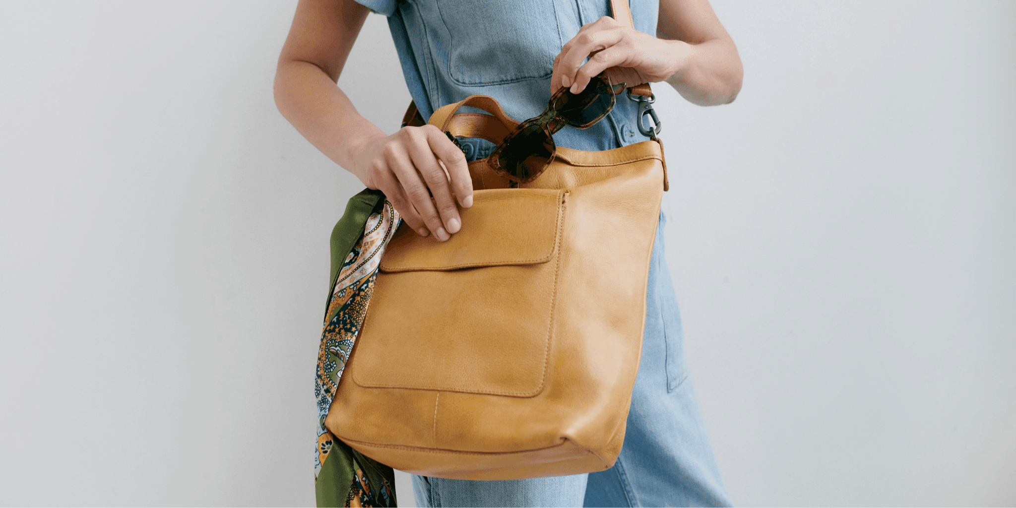 Accessories arranged on a bright editorial surface