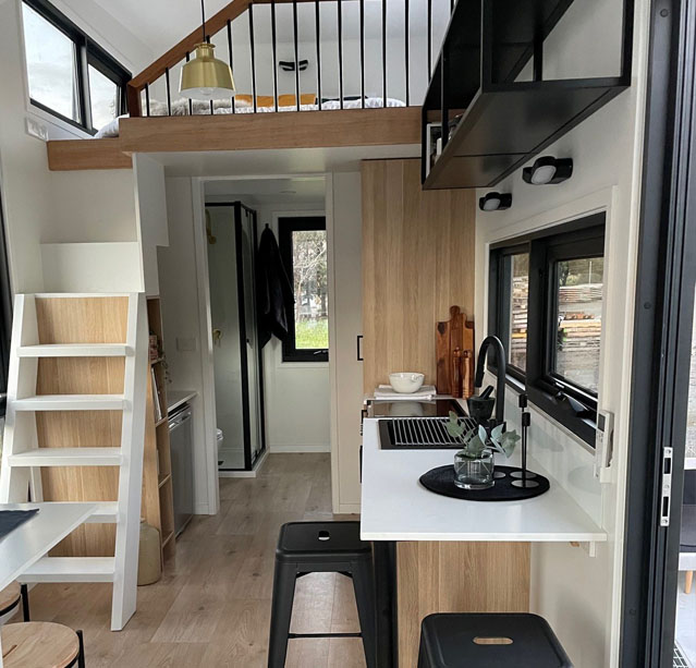 Tiny house interior with space-saving features in the Medium Mini - Tas Mini
