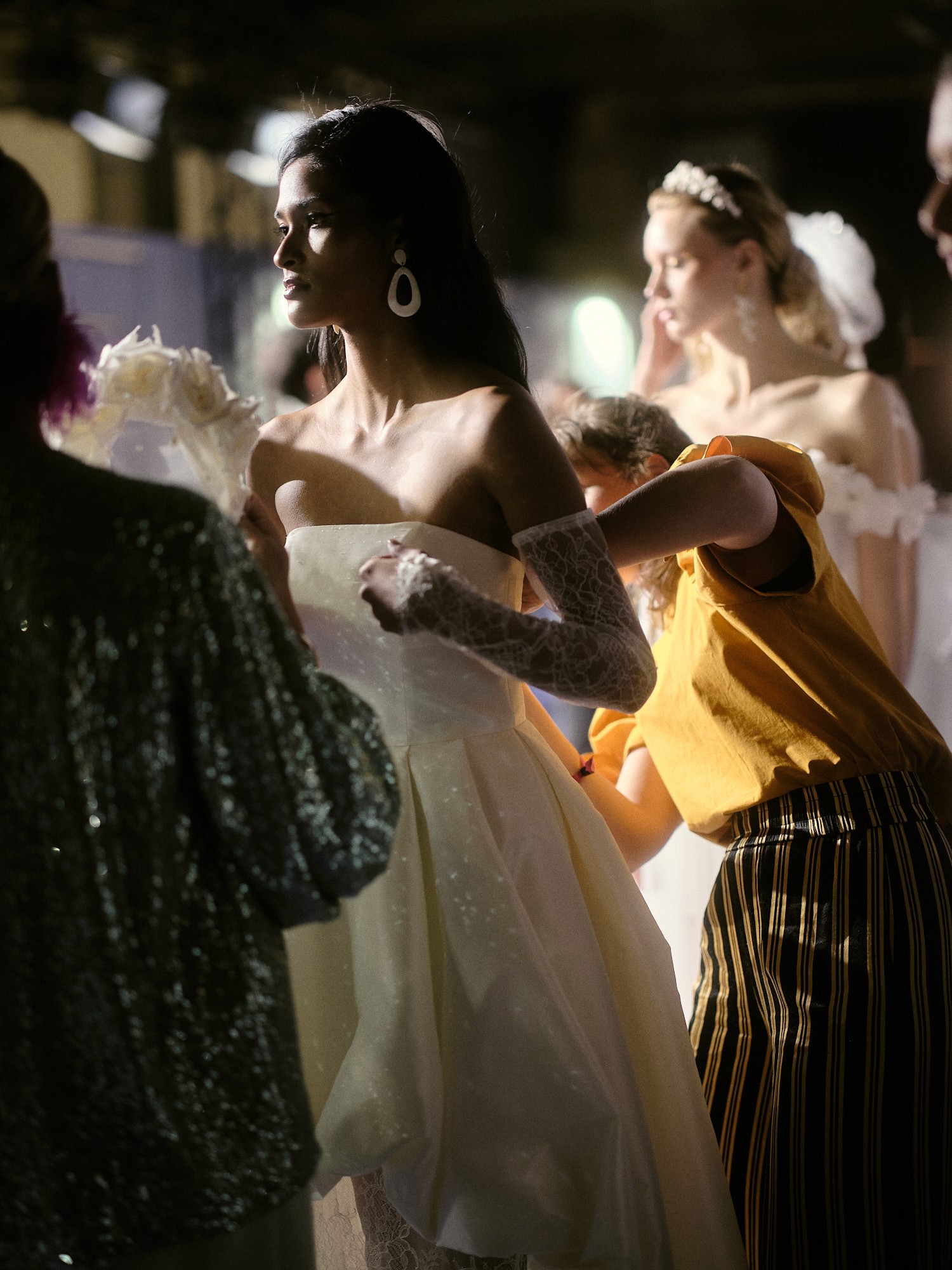 Artistic fashion portrait with colorful floral and avant-garde wallpaper