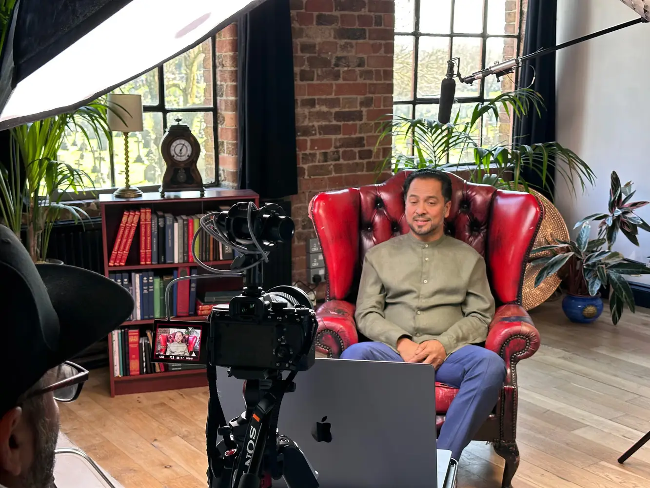Man being filmed in red leather chair for GambleAware testimonial campaign showcasing inclusive storytelling by Mediareach