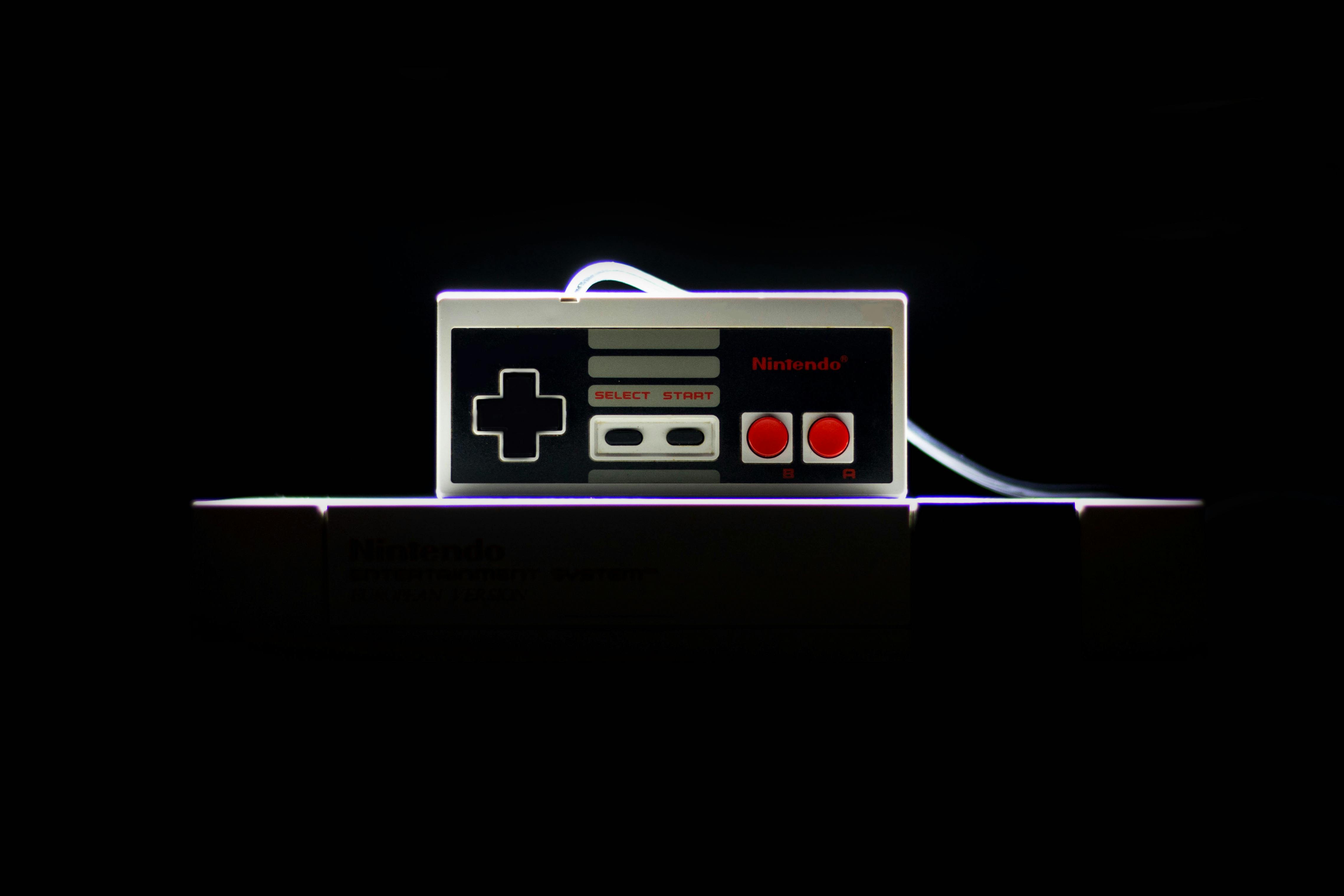Retro game controller centered on dark background