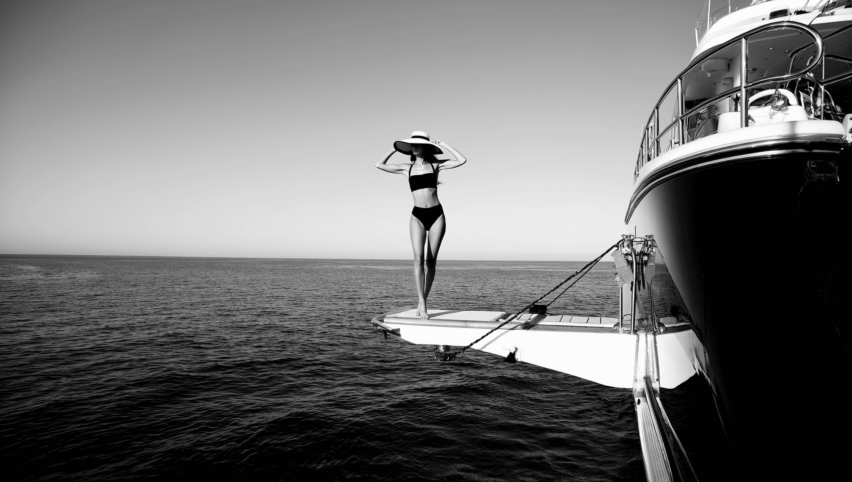 woman on side ladder of super yacht