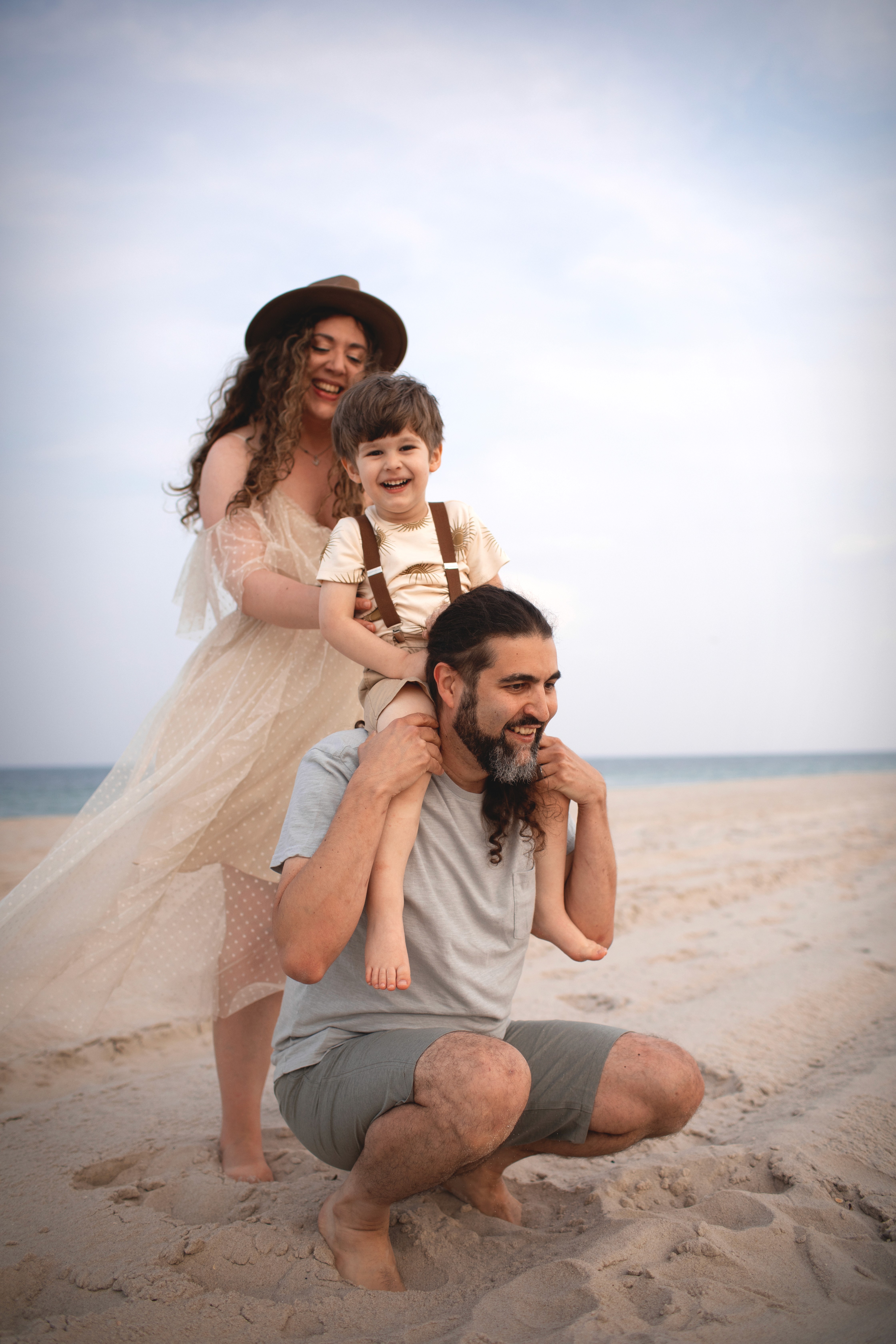 Couple embracing at sunset on the beach during a romantic, natural moment
