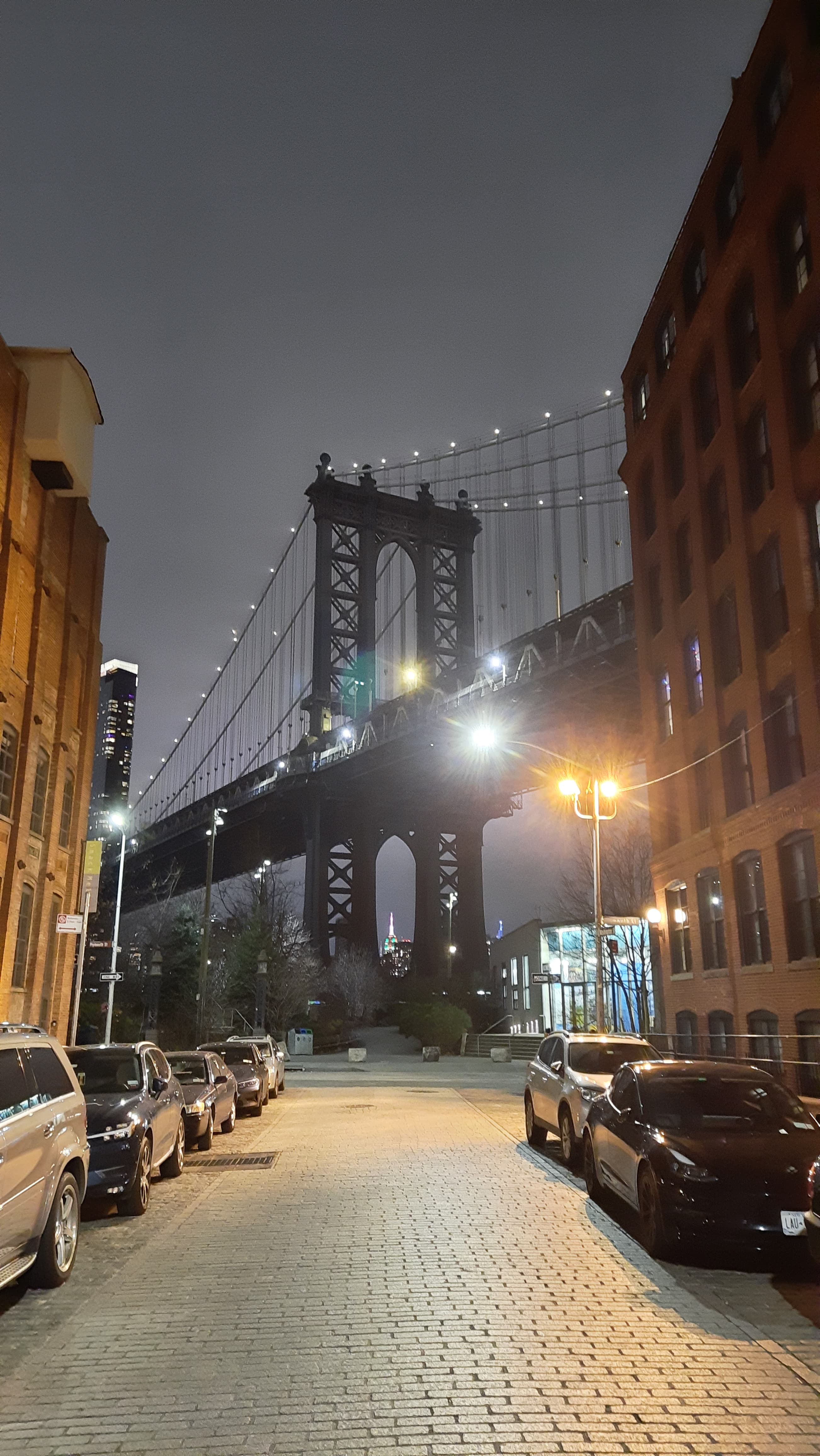 a group of people walking on a sidewalk