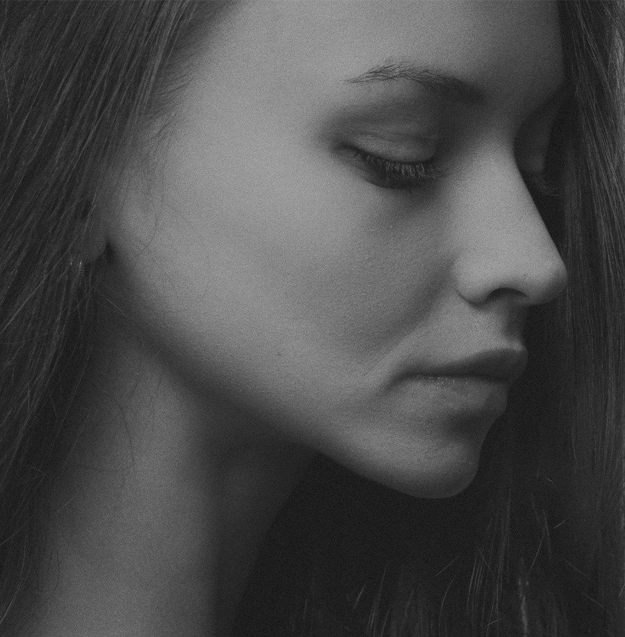 grayscale photography of woman facing sideways