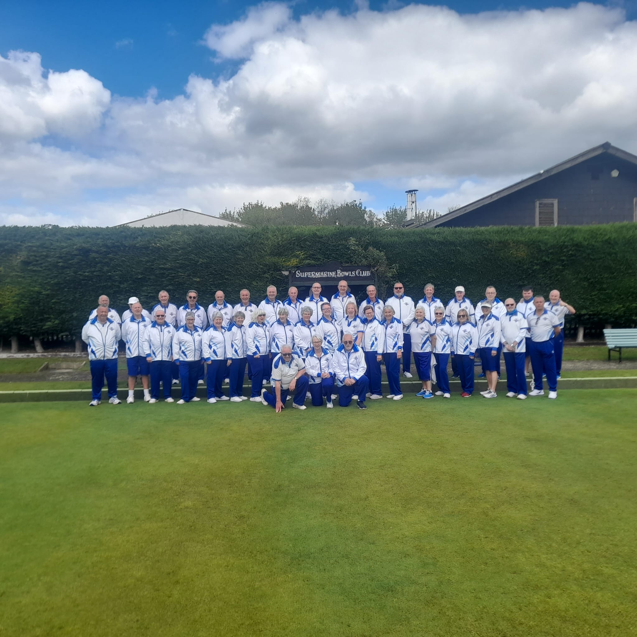person sitting on grass and using phone