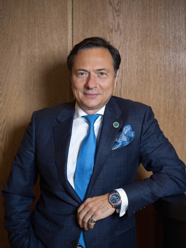 Close-up of a tree stump showing growth rings and a textured brown wood surface.
