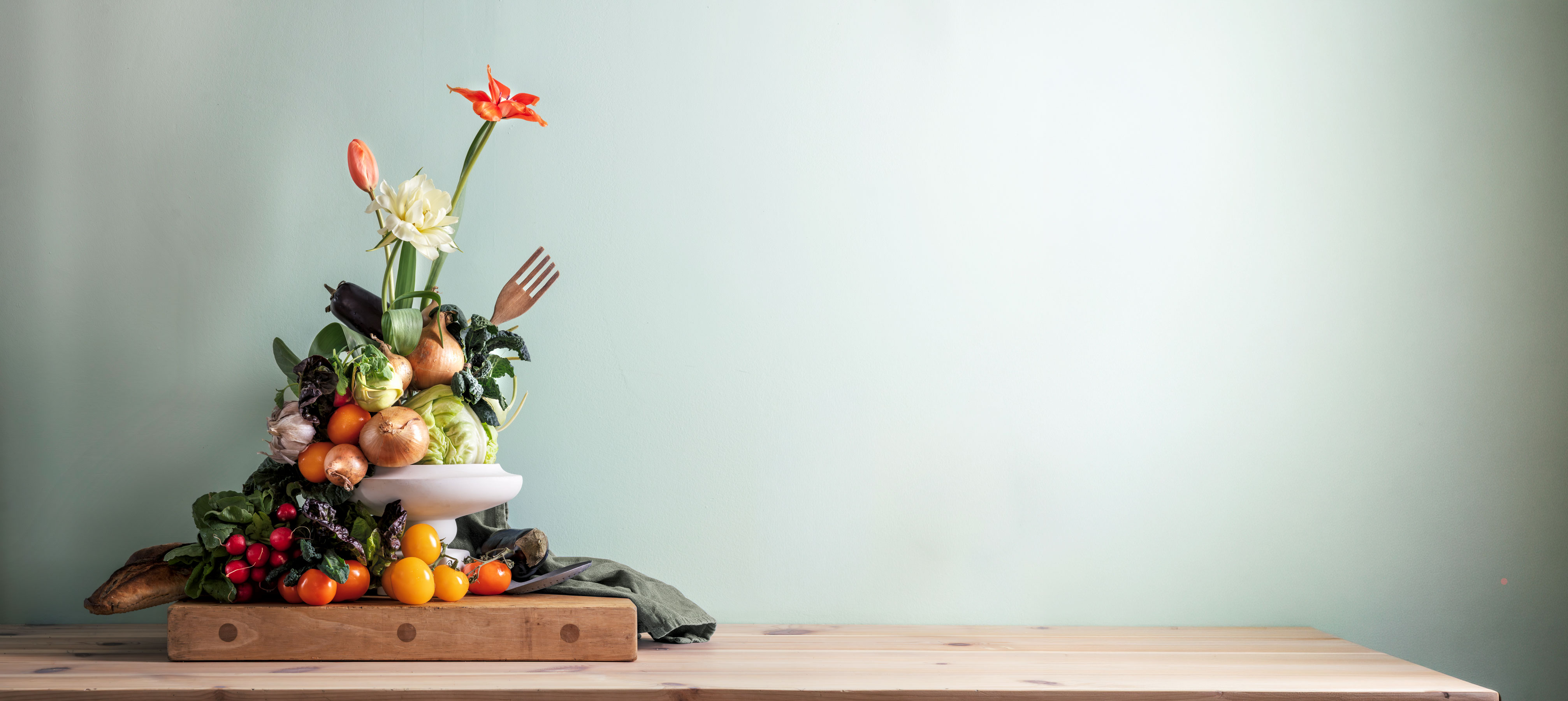  flower arrangement with vegetables on table