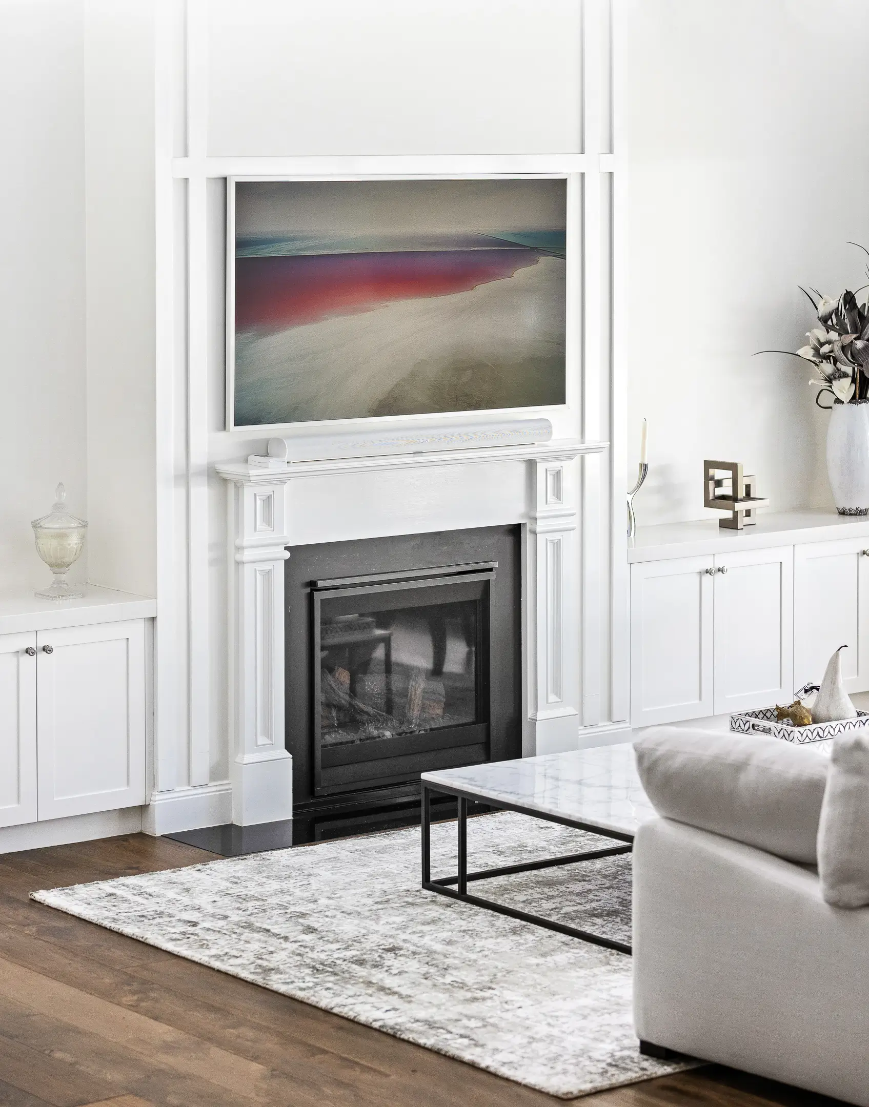 Light coloured materials in the living space with a fireplace