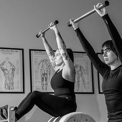 Two girls working on the High Barrel True Pilates Method Camden NSW