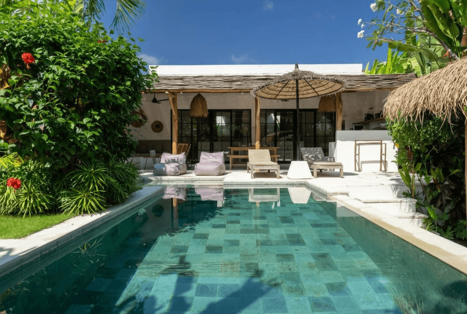 Sunlit private pool and tropical garden. Nyanyi Beach real estate opportunities for serene coastal living in Bali.