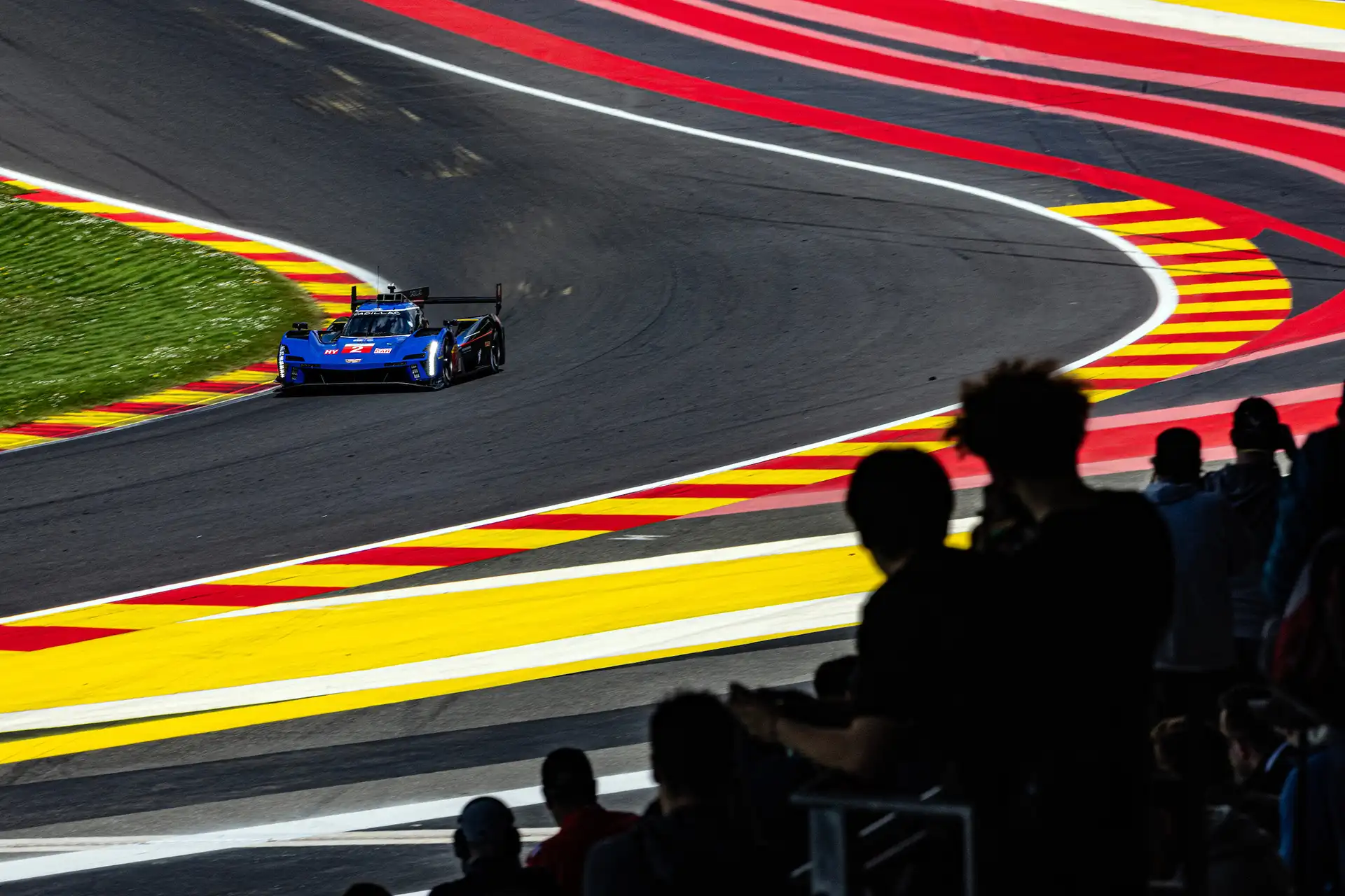 A blue racecar on track.