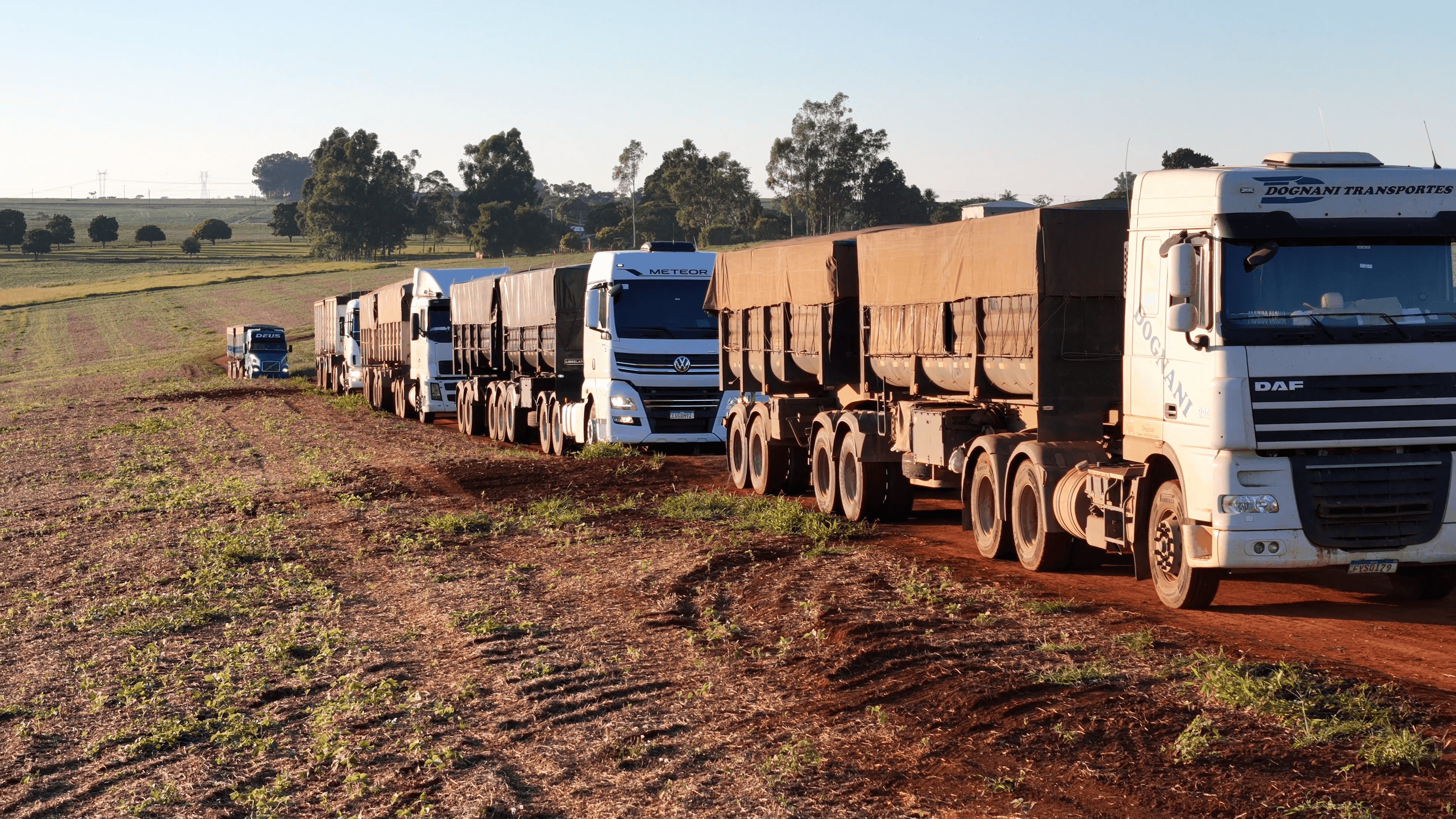 Trucks delivering in field