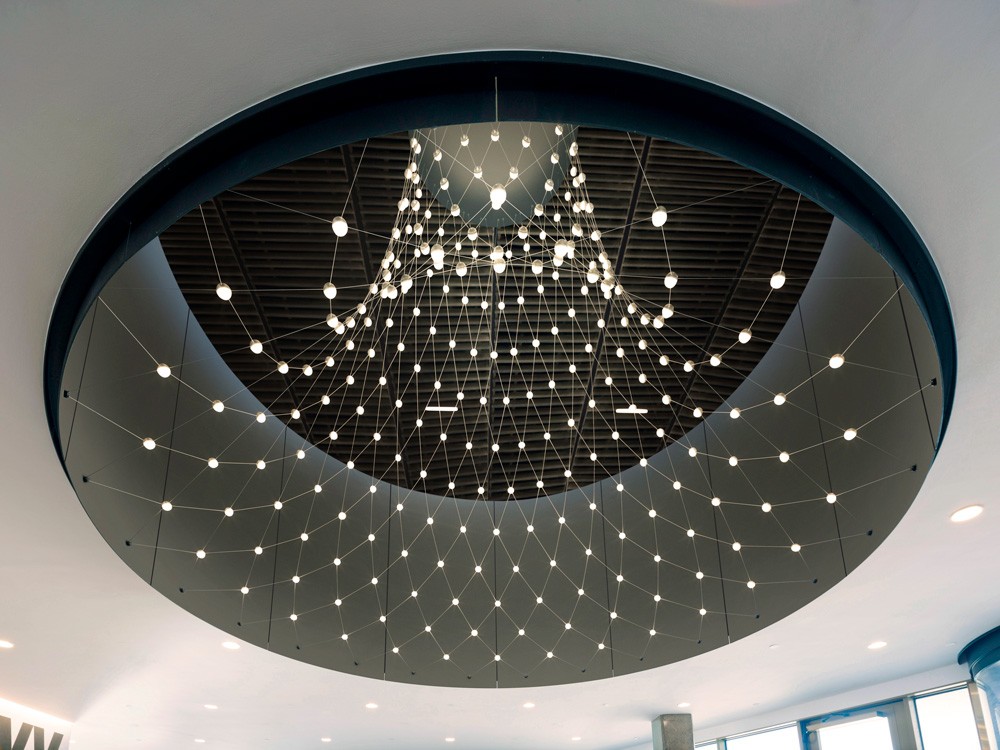 Close-up view of custom LED nodes integrated into the stainless steel cable net at the Botswana Innovation Hub