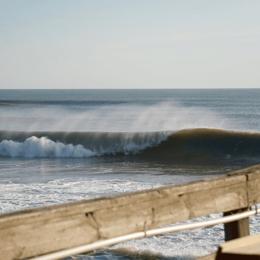 Large wave crashing on shore – surfboard rental in nags-head
