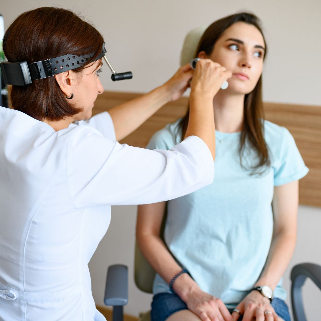 person being fitted for custom earplugs