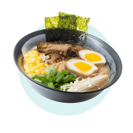 A steaming bowl of authentic Japanese ramen with soft-boiled eggs, pork, and fresh toppings.
