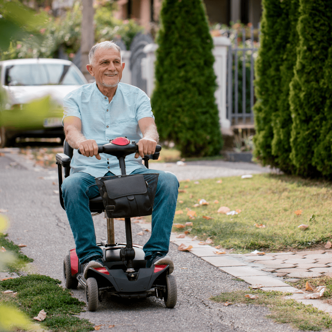 An older man on a mobility scooter