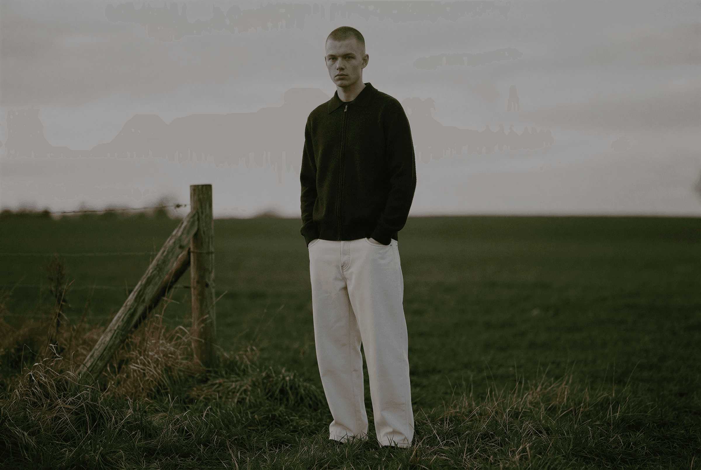 a blurry photo of a person standing in front of a window