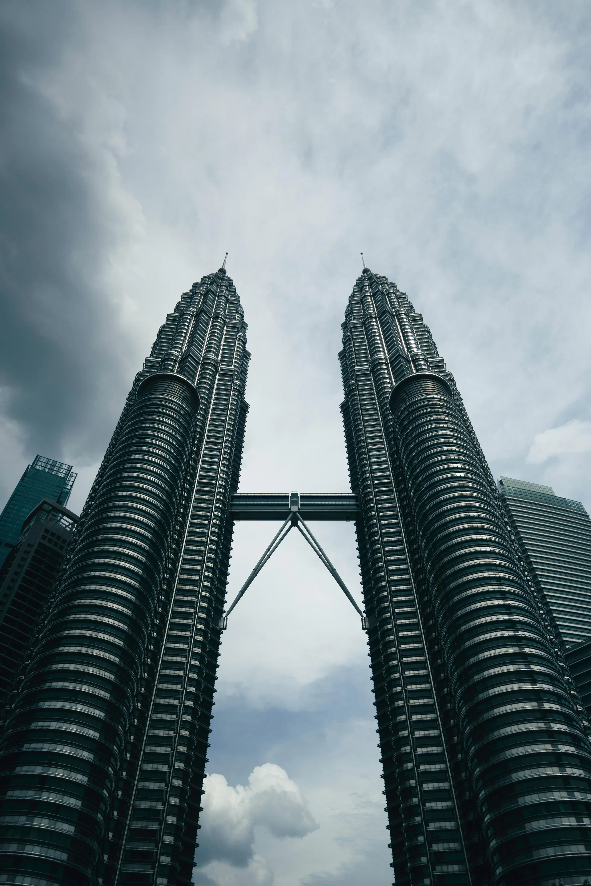 red train travelling near body of water